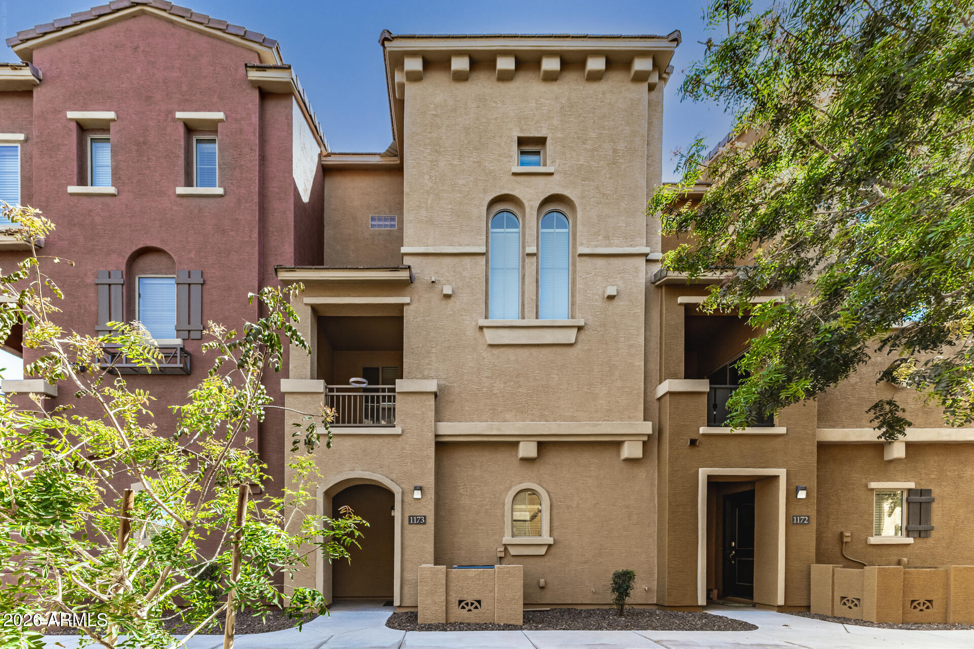 Welcome to this beautifully maintained 2-bedroom, 2.5-bath townhouse with attached garage offering the perfect blend of comfort and convenience. Featuring two spacious master suites, this home is ideal for privacy and flexibility-perfect for guests, roommates, or a home office setup. Enjoy peace of mind with recent upgrades including a newer A/C unit and dishwasher, along with pride of ownership throughout. The open layout flows effortlessly into a private balcony-perfect for relaxing or entertaining. Located in a highly desirable Chandler community, you're just minutes from shopping, dining, parks, and entertainment. With quick and easy access to Loop 101. Residents enjoy community amenities including a gated entrance, sparkling pool, playground.  Ask about assumable loan with low rate!
