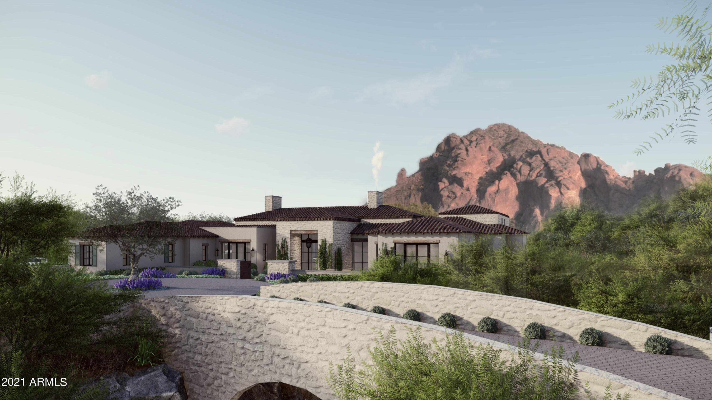 Secluded within Paradise Valley's rolling hills, this opulent estate eludes a majestic grandeur. The stately architecture with modern design elements spares no detail. This estate offers private panoramic views of Camelback Mountain to the east and the Phoenix Mountain preserve to the west. The 2.2 acre lot is optimized for indoor-outdoor living with its spacious covered patio areas and elevated terraces arranged for memorable everyday moments. 
A precisely outlined floor plan enables mostly single level living with voluminous entertaining rooms and shaded natural light adjustable to Arizona's desert heat. The manor-like architecture demands a firm commitment to the finest material selections of stone, wood, metal, and glass. The talented team behind this project include BedBrock Develope with over 20 years of building experience in Paradise Valley, and BedBrock Architecture featuring Stratton Architects offering a premier design service in Paradise Valley. Together, they invite you to experience this exclusive private enclave in the heart of Paradise Valley.