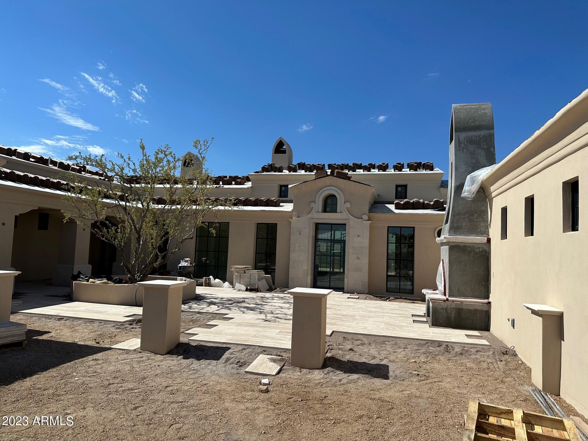 Stunning Beringer Fine Homes constructed home is nearing completion and will be ready for occupancy in November. Cabinets and flooring are starting to go in. This modern Mediterranean style home combines Spanish Revival highlights with old world attention to detail & craftsmanship. Outstanding views of the 13th hole of the golf course, Black Mountain, City Lights and sunsets. Consisting of 5,500 sq. ft. featuring 4 ensuite Bedrooms, including a casita w/private entrance, large game room, wine storage & a 4 car garage. The oversized Master Suite provides a separate sitting/TV room, dream bathroom plus a giant master closet. The outdoor spaces consist of a beautiful veranda, outdoor kitchen, cabana with fireplace and a bocce ball court.