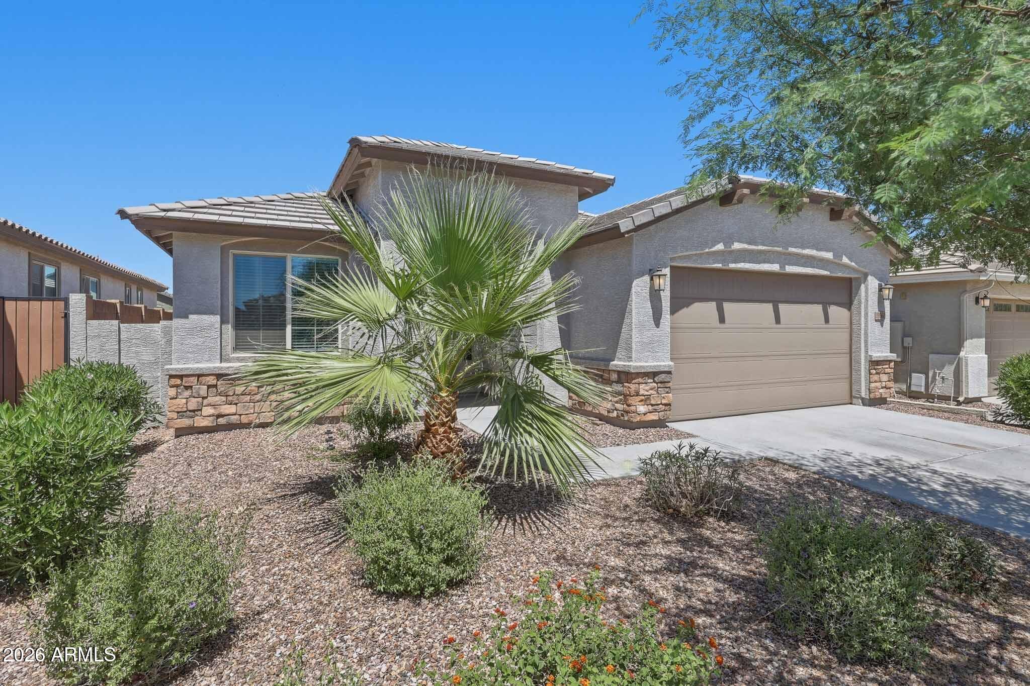 Don't miss this spotless 4-bed, 3-bath gem in Litchfield Park! Great floor plan, with a true 4th bedroom with its own full bath, perfect for guests or multigenerational living. Beautifully upgraded with newly installed engineered hardwood floors throughout the living areas, all bedrooms, and hallways. Tile in excellent condition in kitchen, entry, and baths. The open-concept Great Room flows seamlessly to the Kitchen, Nook, and Covered Patio. Primary Suite with walk-in closet, 2-car garage, and move-in ready condition throughout. This one stands out from the rest!  Agent owned - one of the sellers is a licensed realtor in the State of AZ