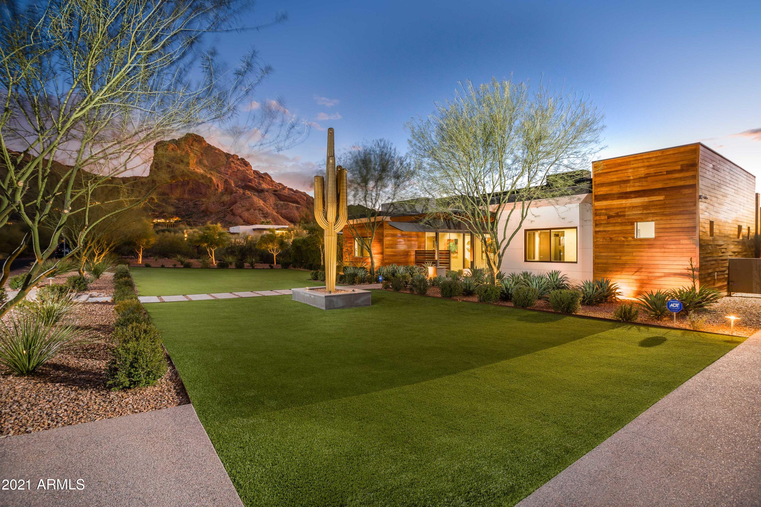 A modern sanctuary at the foot of Camelback Mountain. This is a rare find: a bright and sophisticated Contemporary home in one of Paradise Valley's  most desirable pockets.. Offering custom architecture exudes quiet sophistication. Generous Master Suite, oversized cook's kitchen, high-quality modern design elements, and a wonderful floorplan combine to make this one an easy choice.  All additional bedrooms have en-suite baths oversized guest quarters, heated pool and spa, 5 car garage including 3 lifts for a total of 8. This home is an entertainers dream, plenty of indoor/outdoor living space, rooftop deck to enjoy the sunsets.
Stunning views of Camelback Mountain and the ''praying monk'' are available day and night. 
This ''Heart of Paradise Valley'' location offers a glorious view of t surrounding mountains. Well-sited for privacy, you'll enjoy all the benefits that Paradise Valley has to offer. Easy access to the world class resorts and dining experiences. A walker's dream, you will find access to trails, parks and bike paths.