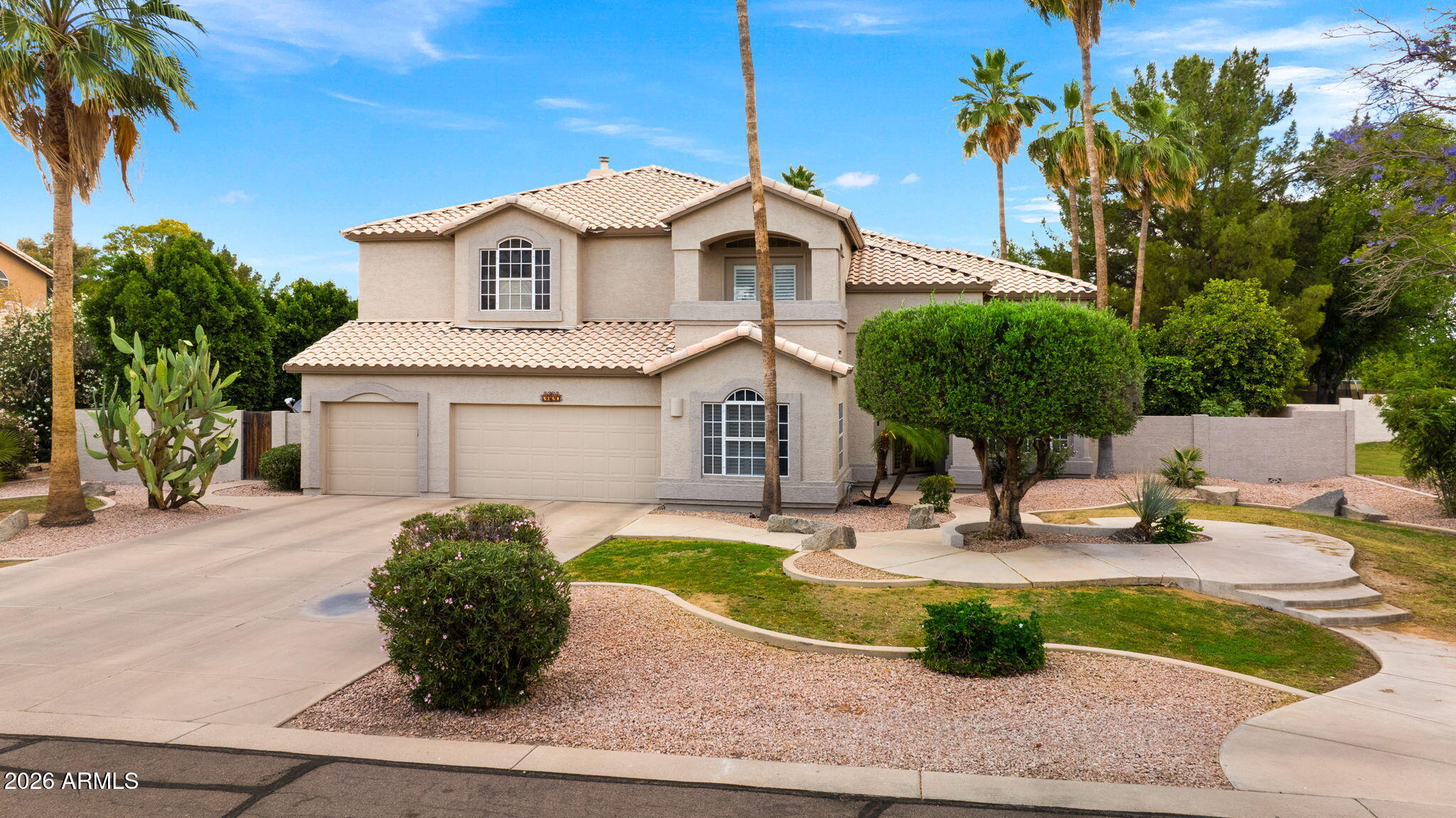 Stunning property, Gorgeous home with all the extras! Located on a cul de sac this home has Central vac, 60 ft lap pool w/ play pool with Venetian tile. Plantation shutters throughout. 5 bed w/office or perfect for a craft/sewing room. Master bed has den/exercise room & fireplace and full length balcony. Covered patio. Granite counters throughout. Travertine tile. 250 gallon propane tank for BBQ, & heated pool. Custom cabinets & Molding. All electric throughout. Citrus trees in back yard. Utility sink and cabinets in laundry. Gilbert school district. Enormous back yard for entertaining.  Private, quiet streets. 3 car garage. Kitchen island, huge great room! Separate living, dining, and family room. Spacious bedrooms.