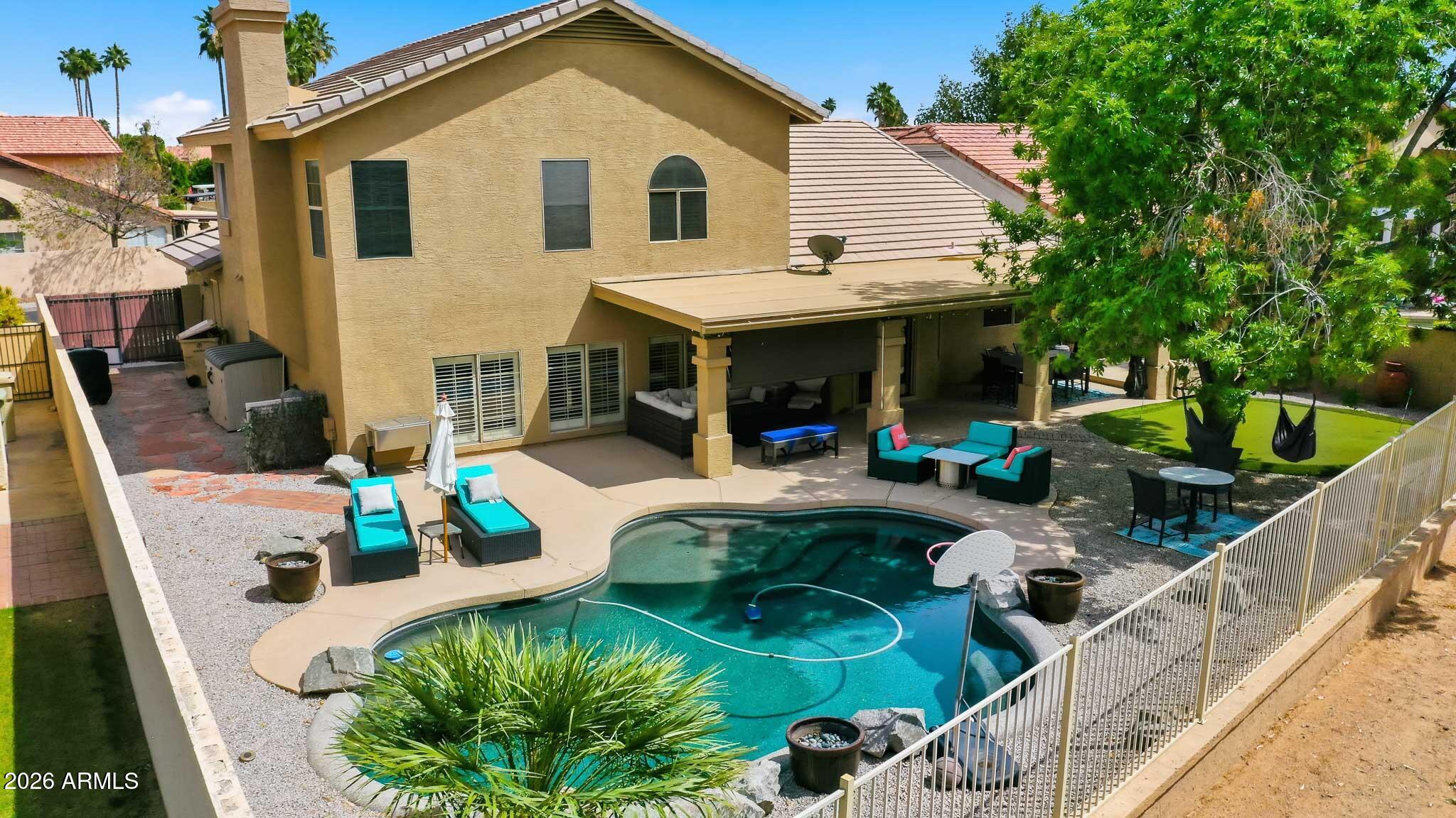 Welcome to this 4-bedroom, 3-bathroom home ideally located along the 12th fairway in The Clubs at Arrowhead. Situated in the sought-after Arrowhead Ranch community, residents enjoy scenic walking paths, lakes, and playground.

Designed for both comfort and functionality, the home offers multiple living spaces without feeling confined. The kitchen features a built-in oven and microwave, a walk-in pantry, and a convenient breakfast bar. Host with ease in the expansive great room featuring a wet bar.  The primary suite provides serene golf course views and a well-appointed ensuite with a soaking tub and walk-in shower. Two secondary bedrooms and a full bath are located upstairs, while an additional bedroom and bath are situated downstairs for added flexibility. Step outside and you'll find your own private oasis. Cool off in the pool, practice your short game on the putting green, or simply unwind in a backyard designed for enjoyment. This home truly brings together comfort, space, and lifestyle.