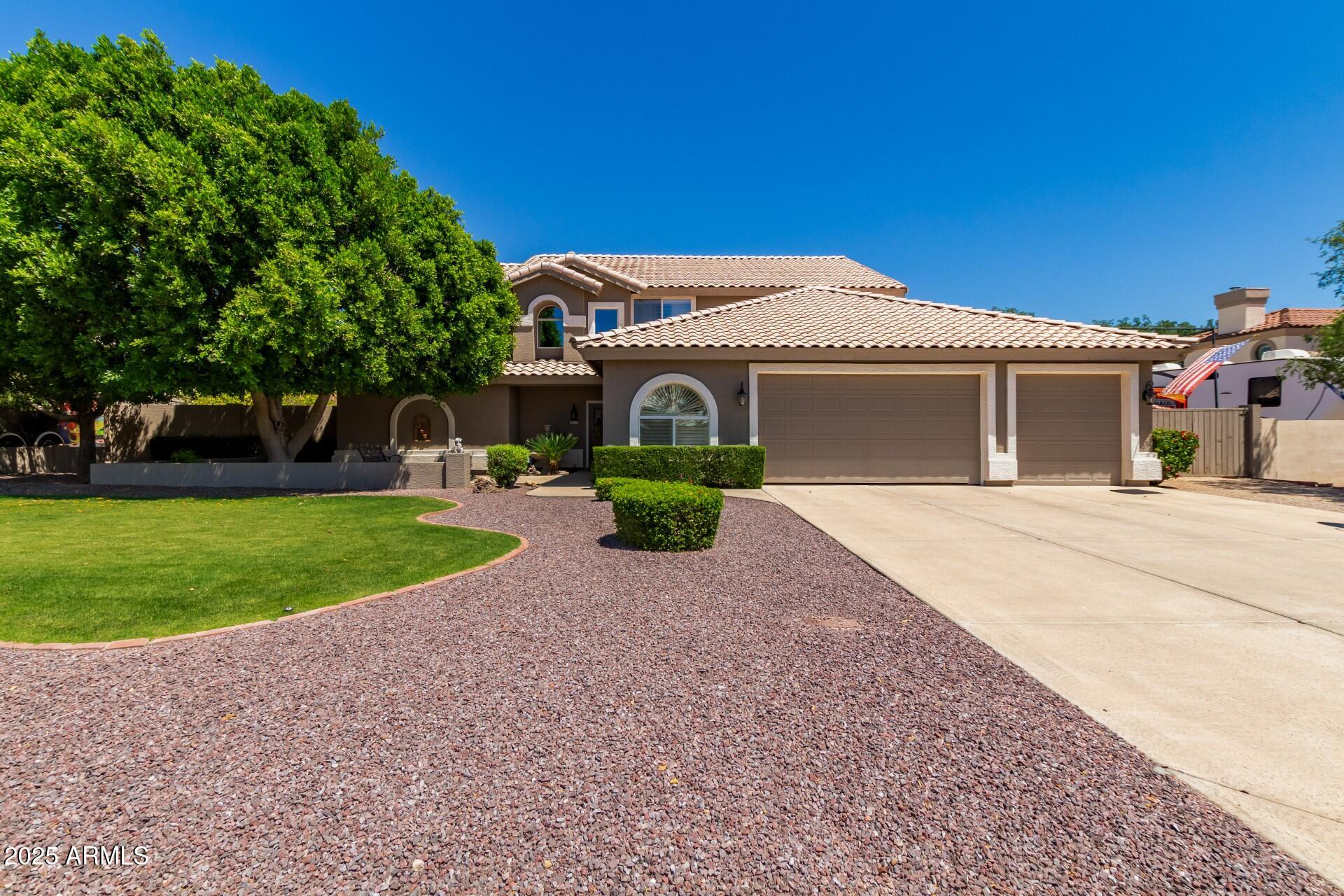 Spacious & Beautifully designed Custom Home features 4 Large Bedrooms, 3.5 Bathrooms, 2 versatile Bonus Rooms, and a 3+ Car Garage with an additional 100 sq ft Workshop or Storage Space. Situated on a generous lot with RV Parking & NO HOA, it offers both Comfort and Freedom. Step through the Front Door with a Glass Panel that opens to let in Refreshing Breezes. The Bright and Airy Living Room showcases Cathedral Windows with views of the Lush Backyard, Oversized Diving Pool, Spa, and Cabana. Adjacent to the Living Room is a Formal Dining area with a Coffered Ceiling, leading through a Pocket Door into a Spacious eat-in Kitchen. The kitchen is thoughtfully equipped with high-quality Cabinetry, Roll-out Pantry Shelves, Granite Countertops, Quartz Sinks, Black Appliances & Custom Aged Paint. From here, access the Family Room, Laundry area, Exercise Room (could be Bedroom #5), Powder Room, and Garage--all with Direct Entry to the Pool and Sport Court for added Convenience. Upstairs, you'll find three Generously Sized Bedrooms, Two Full Bathrooms, and a Large Bonus Room perfect for a Game Room or Guest Space. A Private Balcony off the Bonus Room overlooks the Expansive Backyard and Sport Court. The Backyard is an Entertainer's Dream, featuring Multiple Seating Areas with Cabanas, Ceiling Fans, and Misters--ideal for Relaxing or Hosting Summer Gatherings. The Upgraded Pool & Spa include Swim Jets for Exercise, a Variable-Speed Pump, and a New Heater. The Sport Court has been creatively used for everything from a Batting Cage, Skate Park, Basketball, Cornhole Tournaments, and Pickleball. The open layout has even hosted Weddings and Rehearsal Dinners. Located in a Prime area surrounded by Scenic Mountains, you're close to attractions like Hurricane Harbor, 500 Club Golf Course, Thunderbird Park Hiking Trails, and a wide variety of Shopping and Dining options. With easy access to both the 101 and 17 freeways, you're Perfectly Positioned to Explore the Valley or head North to Cooler Destinations.