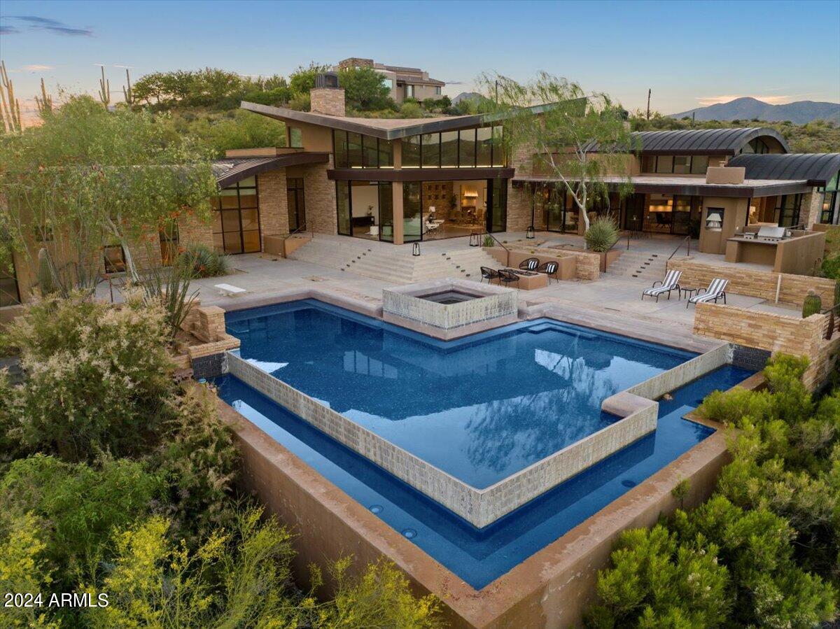 Fantastic Opportunity to own this Desert Mountain SPECTACULAR CUSTOM HOME!! High in the Majestic Mountains of this Exclusive Private Golf course Community, this Amazing Masterpiece awaits you! Sitting on 4.5 acres of natural desert landscape, this Mountaintop Estate has Sweeping Views of the valley all the way to Camelback Mountain. Boasting over 6,000 sq ft of Living space, this sprawling 6-bed 7-bath, split floor-plan All are en-suites. Steel frame construction. Seamless Indoor & Outdoor flow, an impressive negative edge pool & spa, and an outdoor kitchen w/ pizza oven & BBQ, overlooking breathtaking panoramic views! Solid Home w/major Equity & Upside! YOU MUST SEE THIS ONE TO BELIEVE IT!