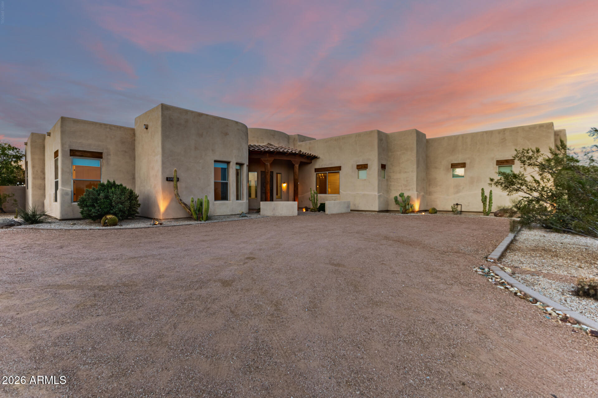 Experience refined desert living in this exceptional custom estate set on 1.13 acres with no HOA and a separate air-conditioned workshop. Offering over 3,280 square feet, this expansive residence features 5 bedrooms and 3 full bathrooms, highlighted by a breathtaking great room with soaring 12-foot ceilings and a dramatic wall of windows that fills the space with natural light, while 9-foot ceilings extend throughout the rest of the home. The open-concept kitchen and dining area also showcase impressive 12-foot ceilings and are designed for both everyday living and entertaining, featuring flowing granite countertops, double wall ovens, a stainless steel refrigerator, and an oversized island with breakfast bar, all complemented by a charming dining area. The split primary suite provides a private retreat with a luxurious en suite bath, complete with dual vanities, a jetted soaking tub, walk-in shower, and two walk-in closets with built-ins. A versatile floor plan includes four guest bedrooms, with one featuring double doors and a built-in desk, ideal for a home office. The separate, 1,000sq.ft. climate-controlled workshop offers incredible flexibility for projects and hobbies, and is thoughtfully equipped with its own powder room, along with a sink and storage. The spacious 3-car garage with built-in cabinets provides ample room for organization. Step outside to the relaxing covered patio or breezeway with built-in BBQ, with plenty of room for RV parking. Ideally located just minutes from the scenic trails of Usery Mountain Regional Park, along with convenient access to the 202 Freeway, shopping, dining, and schools, this remarkable property is a perfect blend of luxury, functionality, and lifestyle.