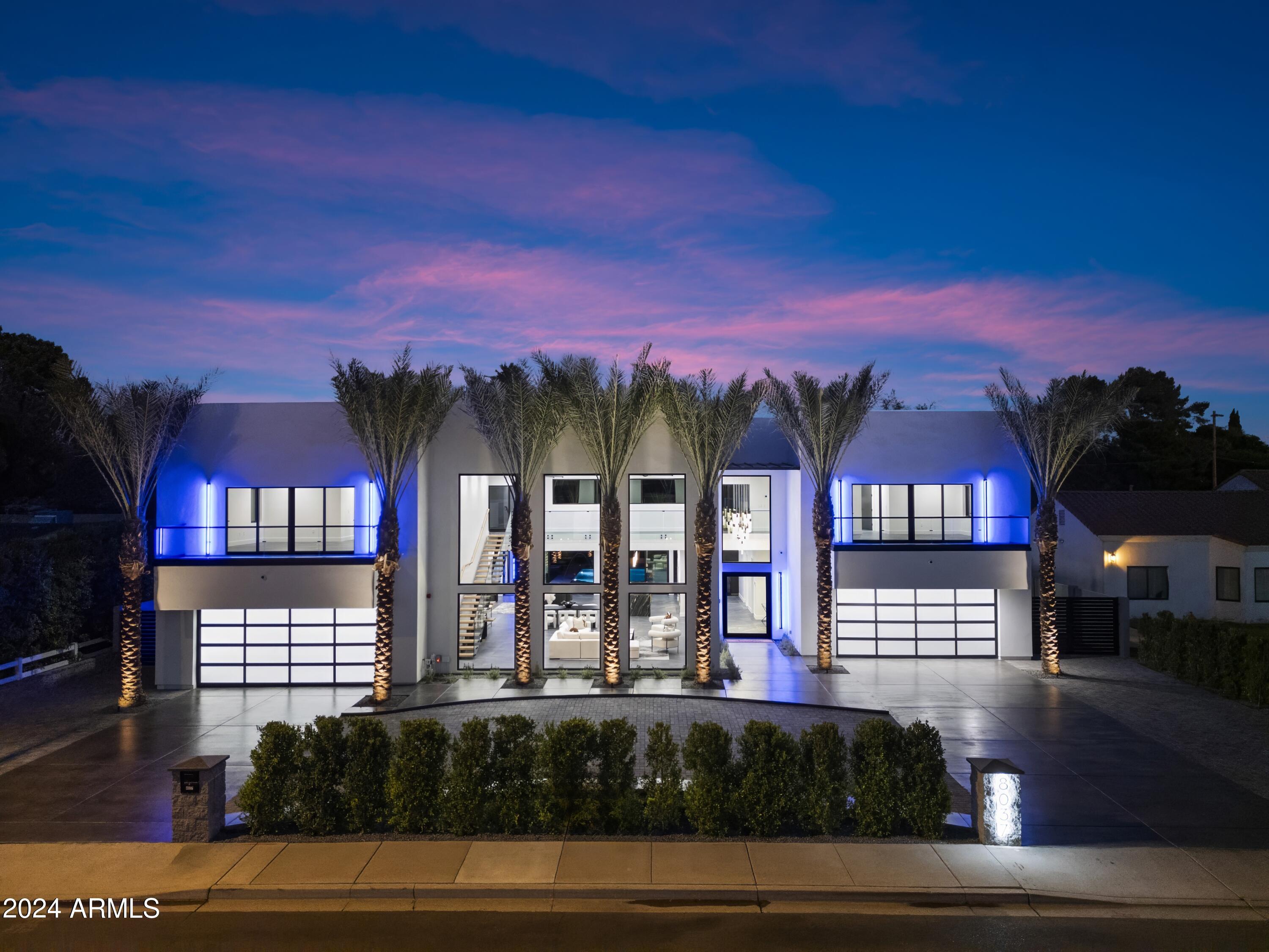 Miami Meets Phoenix!! With a Fashion Glare to Contemporary Lifestyle! Welcome to (Nick-Named) FontaineBleau-New Construction 2024 Just Completed! A Must See to Experience the Quintessential Essence of Sophistication. Features A True Entertainers Style w/ Ease. Starting From Your Fingertips w/a Whole House Programable (RTI) Smart System Including Multiple iPad/Remotes( Lutron, Sonos & more), Full Wolf Appliance Package w/Custom 60inch Stainless Steel Hood, SubZero Frig/Freezer, 18ft Long H2O-Fall Granite Island, 48x48 Tile Floor from Italy, 21ft Enormous Tiled Fireplace, Floating Staircase, 5 Bosh a/c Units, Under-Mount Lighting, RO & Whole House Soft H2O Drinking System, Wine Cellar, 24ft Palm Trees, Resort Style Yrd, Sparking Blue Pool, w/Sunken Fireplace, Full BBQ, & Gazebo. Tons More!! (Lutron, Sonos & more) places control at your fingertips with multiple iPads and remotes. The home is powered by five Bosch 25-SEER A/C units, ensuring maximum comfort and efficiency, while a reverse osmosis and whole-house water softening system adds everyday convenience.
The primary suite is its own sanctuary, with spa-level finishes, an oversized shower, two private toilets, and a custom closet with its own in-suite washer and dryer. A floating staircase, wine cellar, and architectural details throughout showcase the home's blend of style and substance.
Outdoors, a resort-inspired yard awaitscomplete with a sparkling pool, full outdoor kitchen, gazebo, putting green, and a dramatic sunken fireplace with built-in seating. The property is framed by 22-24 ft palm trees that light up at night, creating a private tropical retreat right in the city. To top it off, the neighborhood is known for its welcoming community with regular get-togethers, blending luxury living with connection.
This is more than a homeit's a statement of style, technology, and sophistication. And now, priced below recent appraisal, it is an exceptional opportunity to own one of Central Phoenix's most iconic new builds.