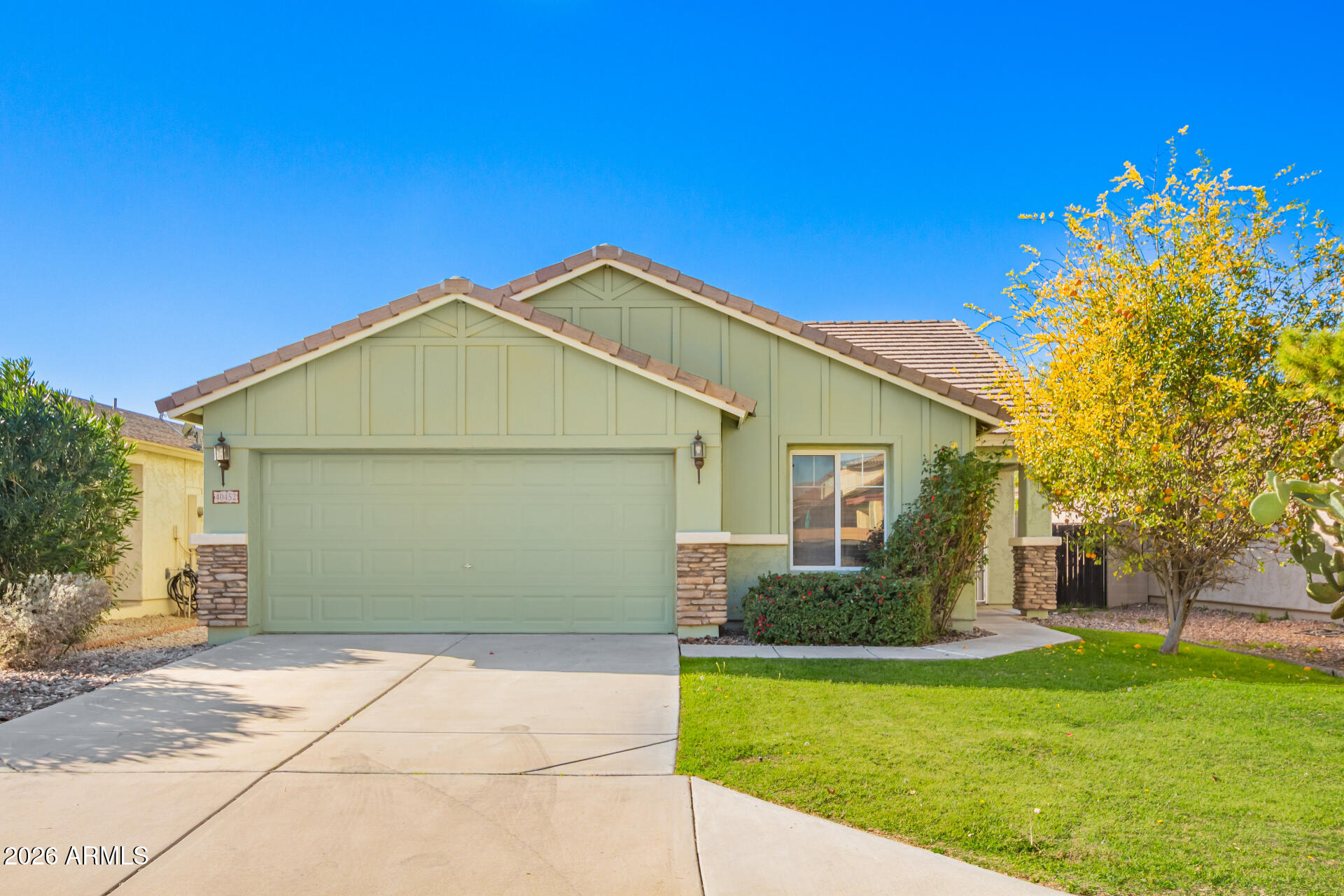 Welcome to 40452 N Scott Way, a charming 3-bed, 2-bath home nestled in the heart of San Tan Valley! This inviting residence offers an open, functional floor plan with comfortable living spaces perfect for everyday living and entertaining. The kitchen features ample cabinetry, a pantry, and a breakfast bar overlooking the main living area. The split floor plan provides privacy, with a spacious primary suite complete with an ensuite bath and generous closet space. Step outside to a private backyard with a covered patio—ideal for relaxing or enjoying Arizona evenings. Conveniently located near parks, schools, shopping, and dining, this home offers comfort, value, and easy living all in one.