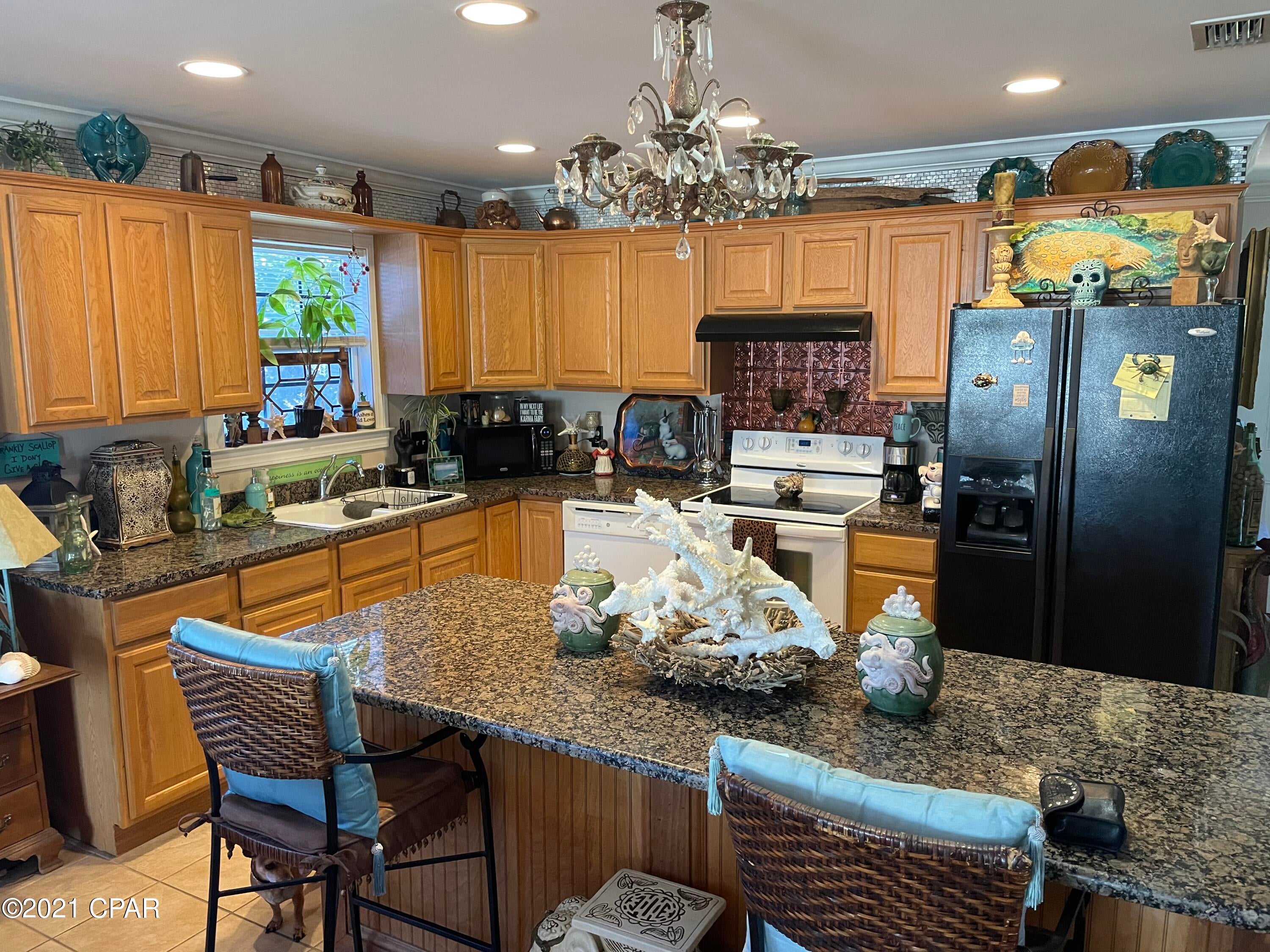 This beach cottage is in a Great Location on Panama City Beach in quiet subdivision with no HOA fees. Large Deck and Pool. Home is located close to schools, shopping, entertainment, Pier Park and within a mile of the Beach. This cute cottage offers 1 bedroom with glass french doors leading to a bonus room which would be perfect for an office, granite counter tops, ceramic tile in the kitchen, laundry and baths and carpet in living area and bedroom. This would be the perfect beach home for a weekend get-a-way or your permanent residence. All information taken from Public Records, please verify if important to buyers.