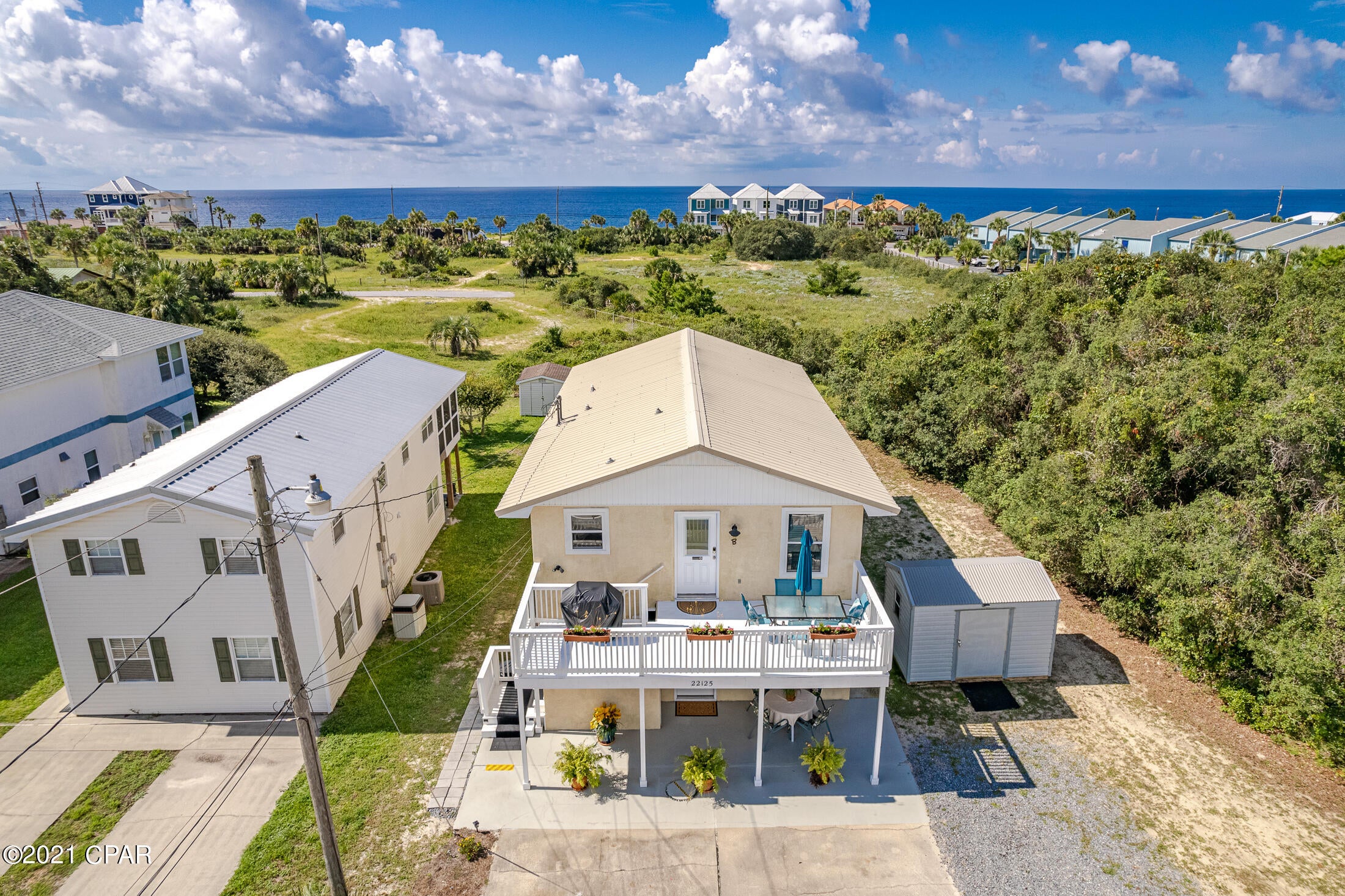 This incredible investment opportunity includes both units of a duplex located only 2 blocks to the beach.  The upstairs unit even offers a view of the gulf!  You'll love the nice size balcony to wind down and relax where you'll enjoy fresh sea breezes and the invigorating smell of the salty air.  Both units each offer 2 bedrooms and a private living room/kitchen so it would make an excellent rental.  They are beautifully decorated with a coastal vibe and ready to use.  The spacious yard offers a feel of privacy and would be great with a pool. 

 Short term rentals are allowed.  Seller says it will easily generate in the $70k's as a vacation rental.  Or live in one while renting the other.  So many possibilities!