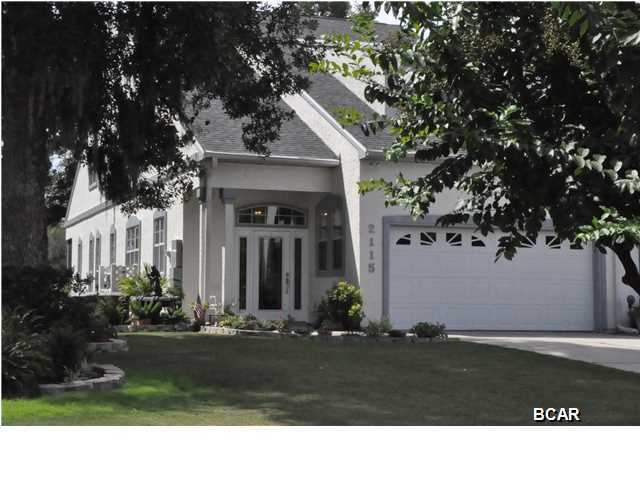 ENJOY THE GOLF COURSE FROM YOUR BACKYARD AND NORTH BAY FROM THE FRONT! THIS LOVELY, END-UNIT TOWN HOME IN PANAMA COUNTRY CLUB FEATURES 3,141 SQUARE FEET OF LIVING SPACE WITH 4 BEDROOMS (TWO MASTERS), 3 1/2 BATHS, A STUDY AND A BONUS ROOM EQUIPPED FOR MEDIA. IMMACULATE AND COMPLETELY UPDATED WITH GRANITE COUNTERTOPS, TILE AND STAINLESS APPLIANCES IN THE KITCHEN, HARDWOOD IN THE DINING AND LIVING AREAS, NEW CARPET IN THE BEDROOMS, FRESHLY PAINTED INSIDE AND OUT, AND A BRAND NEW ROOF! LARGE WINDOWS TO ENJOY VIEW OF THE GOLF COURSE, A SCREENED IN PORCH, TWO CAR GARAGE WITH ROOM FOR AN EXTRA FRIDGE AND GOLF CART, PLUS EXTENSIVE STORAGE THROUGHOUT. WHOLE HOUSE GENERATOR INSTALLED JUNE 2013, A 2 1/2 TON AC AND GAS FURNACE WAS INSTALLED SEPTEMBER 2012 AND NEW ROOF IS FROM JULY 2014. THE
