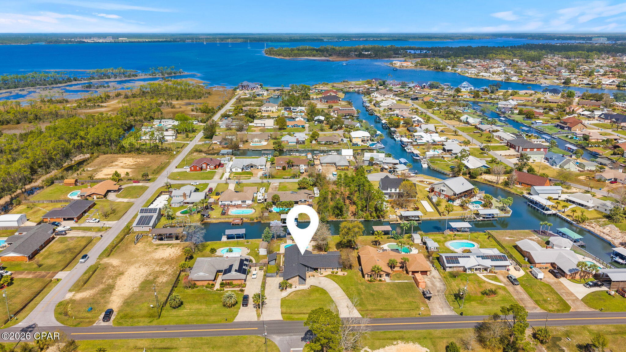 Available to see over the Labor Day Weekend.   
This waterfront home has been strategically repositioned to reflect today's market and now represents one of the best waterfront values available..
There's something about the water!
One level. One Owner. Built to be lived in and loved for generations. True coastal culture with a private pool, canal frontage, and a covered dock--perfect for fishing, boating, and unwinding by the water. Pack your picnic and head over to Shell Island. The residence features 4 bedrooms and 2.5 baths, including a flex room conveniently located just inside the entry from the drive-through garage, opening on both sides to create a porte-cochère style arrival and exit. No HOA This NorthShore waterfront home is ready for its next chapter and offers an exceptional opportunity along the Emerald Coast
(Buyer to verify all dimensions, measurements, fees & written information).

Top Features | Property Highlights
- Hidden panel Bosch dishwasher seamlessly integrated into the island for a sleek look and ultra-quiet performance
- Premium JennAir cooktop
- Brand new, never-used Samsung double-door microwave/convection oven
- Samsung refrigerator in like-new condition
- High-efficiency HVAC system
- New drywall with double insulation Top Features | Property Highlights
- Hidden panel Bosch dishwasher seamlessly integrated into the island for a sleek look and ultra-quiet performance
- Premium JennAir cooktop
- Brand new, never-used Samsung double-door microwave/convection oven
 - Samsung refrigerator in like-new condition
- High-efficiency HVAC system
- New drywall with double insulation