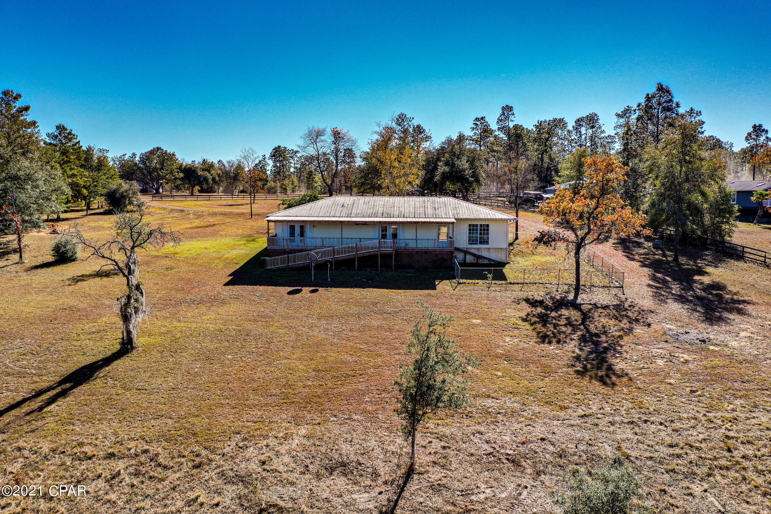 CURRENTLY UNDER CONTRACT, SELLER ACCEPTING BACKUP OFFERS. Looking for a quiet lakefront home with plenty of land, look no further. This waterfront home is located in the quiet Grassy Pond ranch subdivision of Chipley, Fl. Situated on a 2.5 acre lot with access to grassy lake that features excellent bass and brim fishing, and wonderful waterfront views from the back deck. Electric trolling motors are allowed on the lake, no gas. Home is a 2 bed and 2 bath floorplan. The home was built under ADA compliance. All doors are 36 inches, wheelchair height countertops, and Surehand lift with zero entry shower in the master bedroom. Roof and hot water heater are 2009, A/C is 2021.