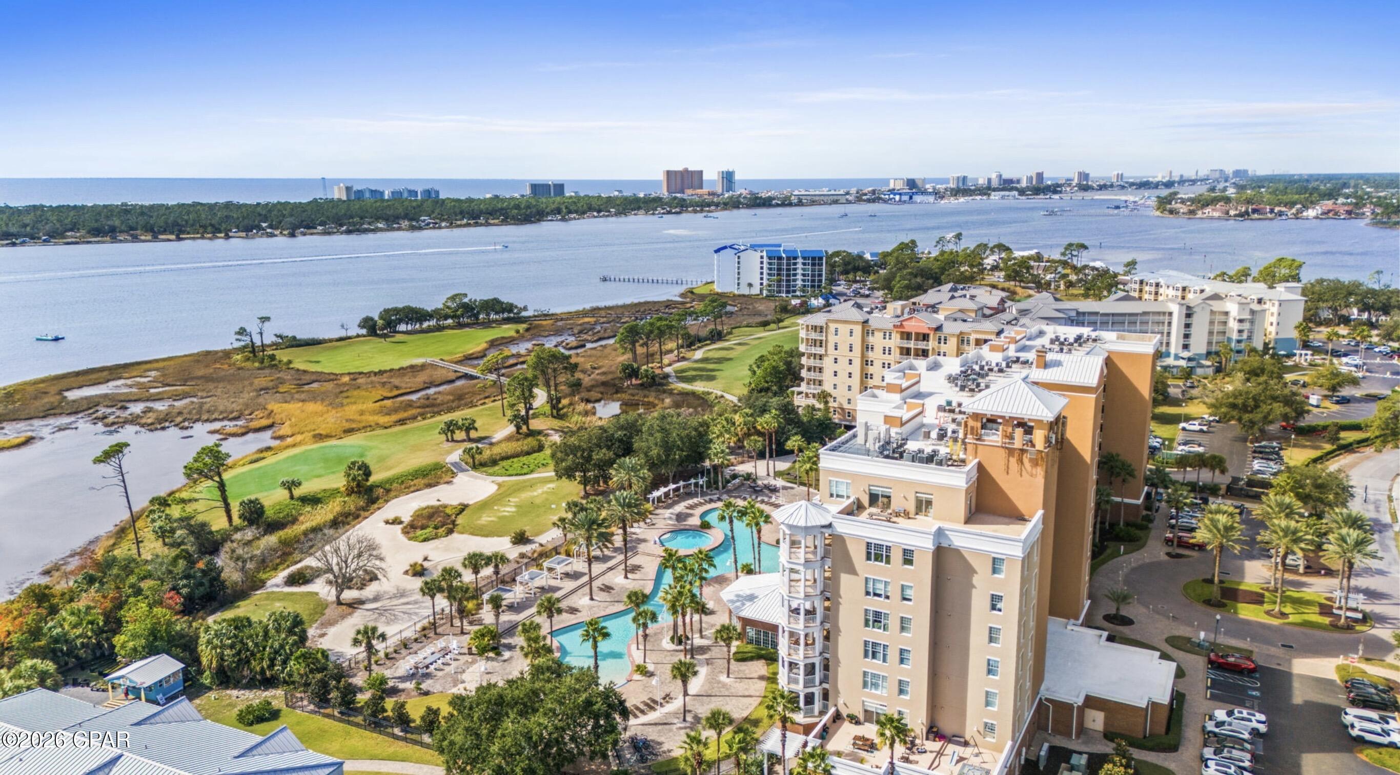 Welcome to Reflections at Bay Point! Enjoy the breathtaking, unobstructed views of the Gulf, lagoon, St. Andrews pass, golf course and resort style pool from your personal balcony!  This exceptional 2- bedroom, 2-bathroom unit offers a seamless open concept layout and comes fully furnished. Premium upgrades include tile floors, granite countertops, stainless steel appliances and in unit washer and dryer. The main bedroom features direct access to the balcony and the attached bathroom includes a walk-in shower with dual sinks. Residents and guests enjoy access to a 10,000 square foot resort style pool, an additional heated pool and a relaxing hot tub. Additional amenities include outdoor grills, cabanas, on site restaurants and a full service spa. Short term rentals are allowed in this building! Please call to set up a showing!