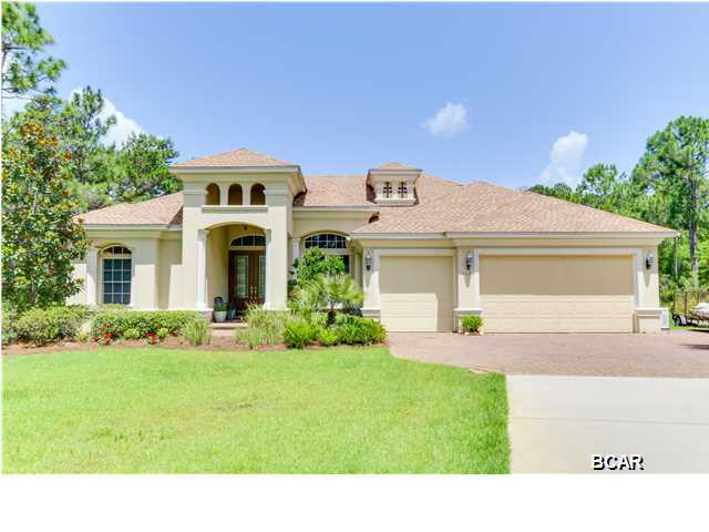Live in style and luxury in the quiet community of Port St. Joe, Florida, less than a half mile to the beautiful beach (dog friendly)and Gulf of Mexico! This custom built Arthur Rutenberg home is opulent with dozens of special features to enhance your life. There are two indoor living spaces, one connected to the gourmet kitchen. Energy efficient doors disappear into the walls to create an outdoor space with a screened pool and hot tub with fire bowls and an outdoor kitchen. The master suite encompasses the south side of the home and also opens to the pool deck. His and her master closets have custom wooden shelving and lead to the stunning master bath, with granite, double vanities, a Jacuzzi pure air tub that self cleans and separate shower. Two of the bedrooms share a private hall and nice hallway bath. There are separate guest quarters with another full bath and another spacious bonus room upstairs with screened porch overlooking the pool area. The kitchen is a gourmet chef's dream with convection oven, convection microwave, a warming drawer, and Wolf 6 burner cooktop. The appliances are the best available! Your friends will have ''pantry envy'' with a walk in pantry off the kitchen. There are so many special features in this home - there is an attached list for your convenience. Ask your Realtor for all details! Please make an appointment today to see this rare, newer, home close to Tyndall Air Force Base, Sacred Heart Hospital in Port St. Joe, and the Gulf of Mexico!  Room sizes and square footage are approximate.  If important, please measure.