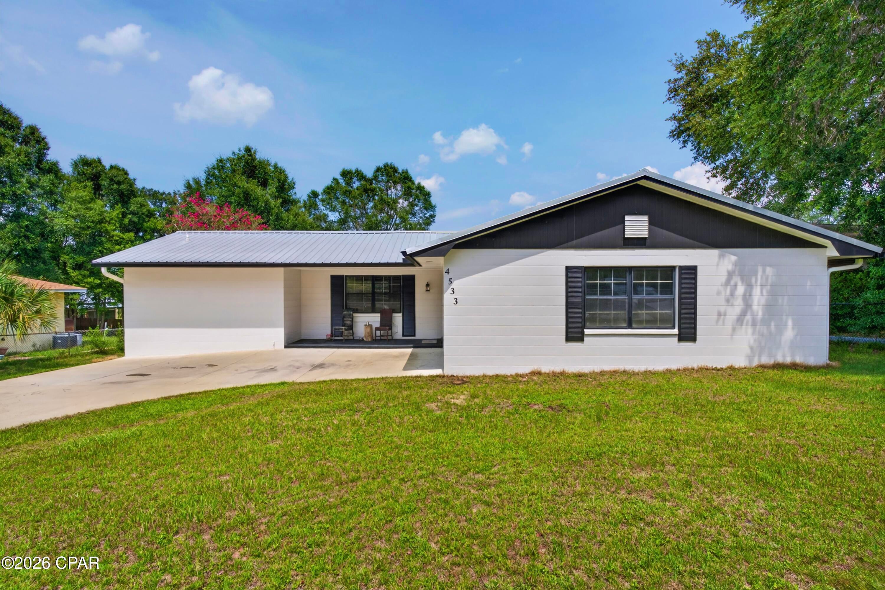 Welcome to this peaceful Sunny Hills home on over one-third of an acre with a lake view and room for a boat or RV. Major updates include a 2021 metal roof and 2021 HVAC, plus a fully fenced yard and inviting screened porch overlooking the lake.

- 2021 METAL ROOF
- 2021 HVAC
- 2021 ELECTRIC WATER HEATER 
- LAKE VIEW
- OVER ONE-THIRD ACRE
- ROOM FOR A BOAT AND/OR RV
- 10 X 20 SCREENED PORCH
- QUARTZ COUNTERTOPS
- SOFT CLOSE CABINETRY
- LG APPLIANCES
- CUSTOM TILED SHOWERS
- FULLY FENCED FRONT AND BACK YARD
- 1 CAR GARAGE
- 10.4 X 12 UTILITY BUILDING
- OPEN DECK
- COZY FIREPLACE

With its generous lot, lake view, valuable updates, and peaceful setting, this solid home provides a comfortable place to make your own.