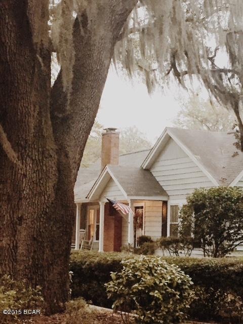 OPEN HOUSE SUNDAY 12/6 1-3:00. ONE OF A KIND-- the PERFECT Cove home! Nestled under massive moss-draped oaks & a short stroll to Beach Dr, this gorgeous home was Custom-built in the 1930s & has been lovingly restored with modern updates, while still retaining the vintage details that make it unique. All the things you want in a vintage home are there: beautiful original windows (enclosed inside new windows for energy efficiency), original HARDWOOD FLOORING throughout, original interior doors & doorknobs.  However, it also contains: brand-new stainless appliances & quartz countertops, modern open floorplan, huge bedrooms, a two-car garage, fully-electric workshop, & a downright enormous laundry/mudroom. Roof was replaced within the last 3 years, A/C 1 year old, new wiring, new plumbing,