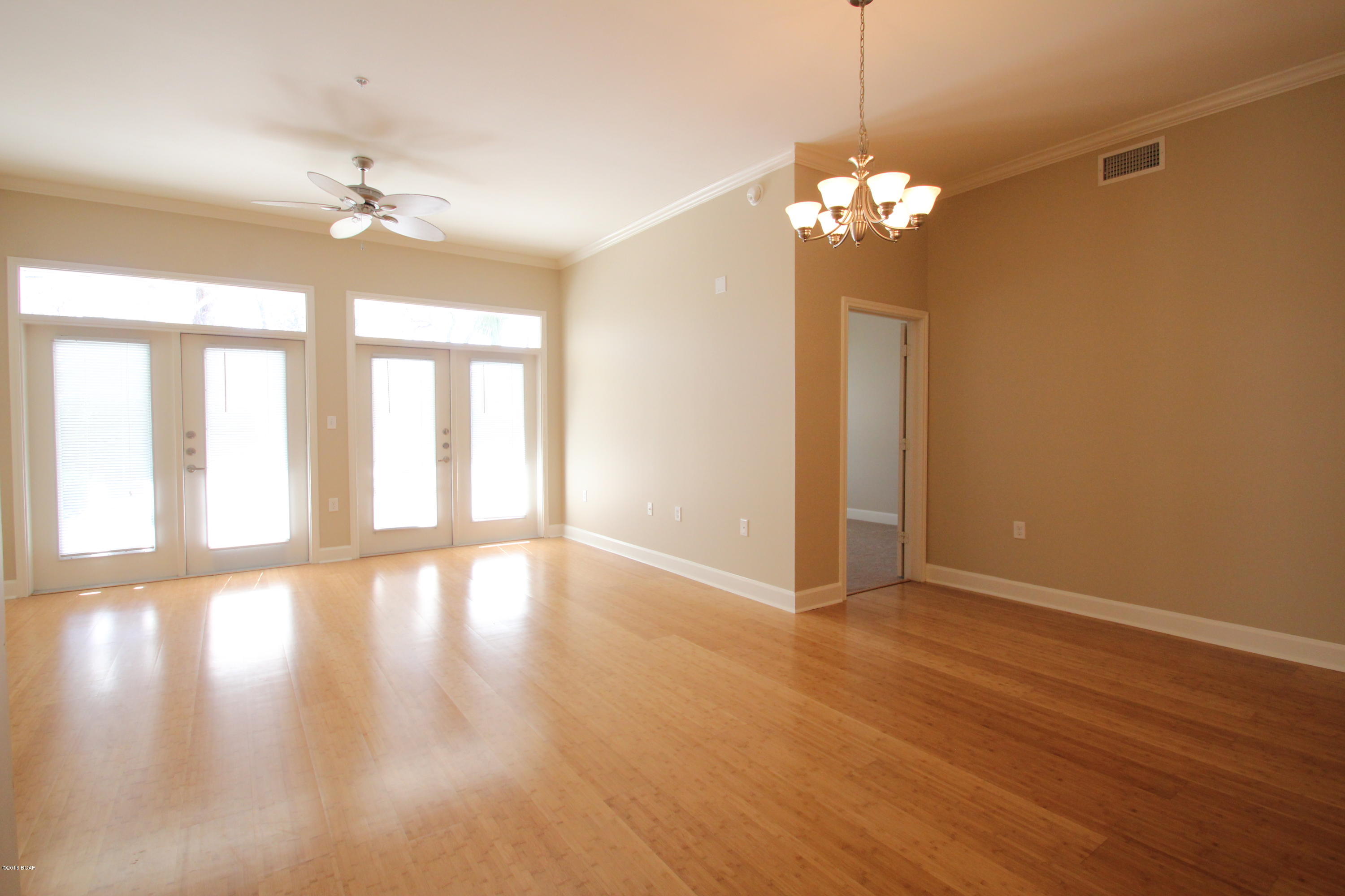 One of the Lowest Priced 2 bedroom 2.5 bath condos in the Entire Complex!! If you haven’t been to Island Reserve recently then you are missing out on something great. Life at Island Reserve is similar to what you might expect from a 5 star resort. Island Reserve is an oasis away from all the hustle and bustle of Panama City Beach, but in a prime location: just a little over a mile away from both the World’s Most Beautiful Beaches and the Hathaway Bridge. Island Reserve features low association dues and unbeatable amenities including the largest pool in the Bay County area (1 acre) w/ two waterfalls, a Splash Pad for the kids, numerous seating arrangements for your poolside entertaining, a heated and cooled indoor basketball court, fully stocked state of the art fitness room, a game

ro a theater with an 105 inch screen, gated community with security. Plus, no short term rentals are allowed in Island Reserve so that means no Spring Break traffic at all! Mainly full time owners and residents throughout the entire complex. This is truly turning into one of the premiere residences in all of Bay County with a very well run association and friendly maintenance staff. Basically everything is taken care of when you live here at Island Reserve. The unit has 2 Master Suites and each bedroom has a door to the large private patio. The rich Bamboo Floors and Granite Countertops throughout along with Stainless appliances make this luxury condominium hard to resist. There are elevators and stairs in each building. Covered Garage parking so you don't ever get wet coming in from the rain. Lowest priced Ground Floor unit in all of Island Reserve. This one won't last long at this price. Resort Living close to everything in Panama City Beach. Beach is 1.4 miles away or 3 minute drive from Island Reserve.