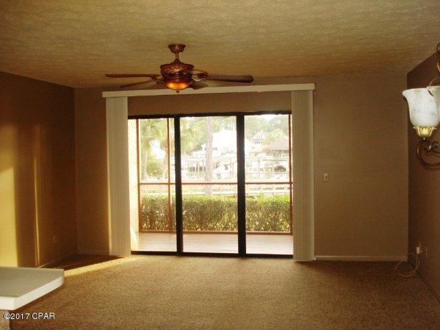 Condo has 1 bedroom,master bath with double sinks and 1/2 bath for guest. The patio is fully enclosed with a nice view of the lagoon. The pool is located just across from the front of the condo and there is a gazebo and dock in the back of the unit. This is a must see condo!