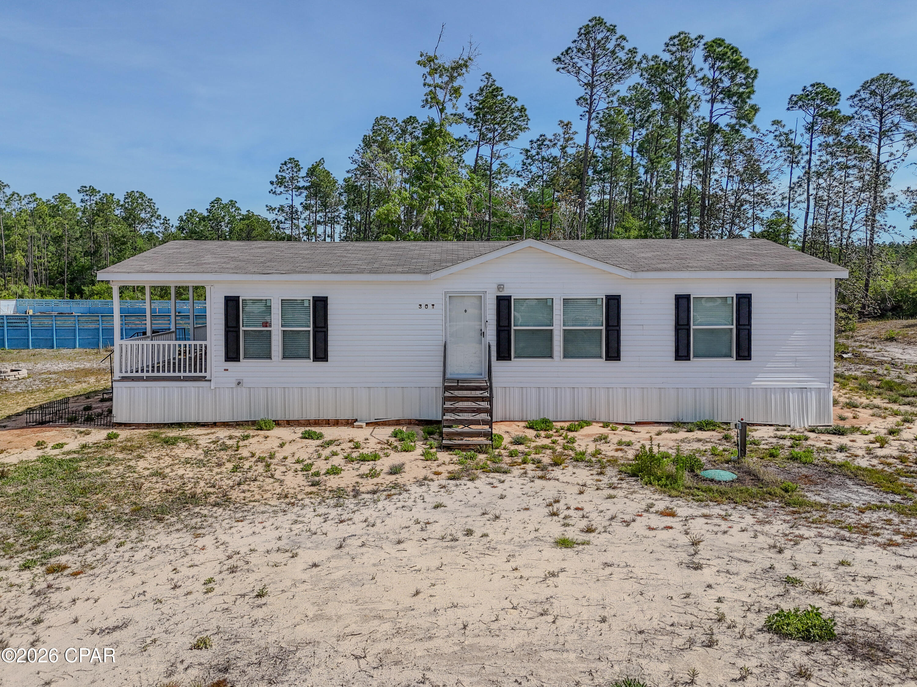 Immaculate home on 0.6 acres! This 2023 Clayton The Southern Farmhouse manufactured home is perfect for growing families or first time home buyers. The home features LVP flooring, rustic styling, a split floorplan, an over abundance of cabinets, loads of natural light, and a covered porch. All the benefits of buying new without the wait! Located in Southport so only minutes from the center of town and the beaches.  Opportunity is knocking, will you answer!?!