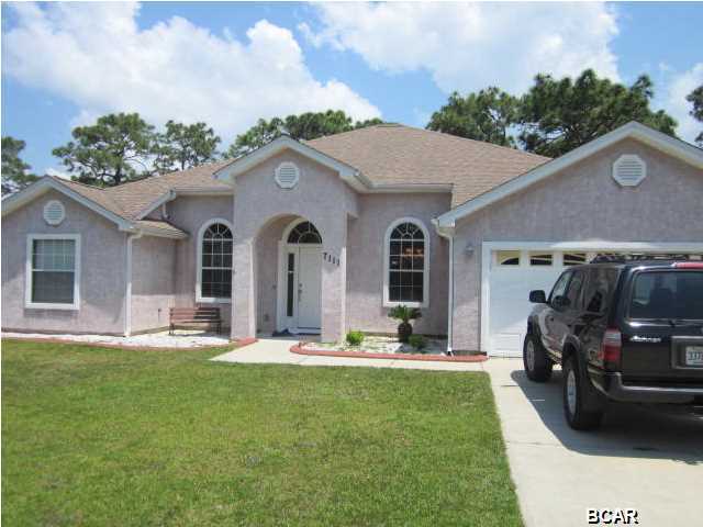 7111 Maxwell Court, Callaway. This nice executive home is a 4 bedroom/3 full bath home and it is located in a nice Callaway subdivision. It is short commute to Tyndall Air Force Base and a short walk to the bay. It has a large open floor plan with separate dining room and split bedroom floor plan, including a spacious screened Florida Room. Spacious Master bathroom has a jetted soaking tub. Flooring is Hardwood, Carpet and Tile.