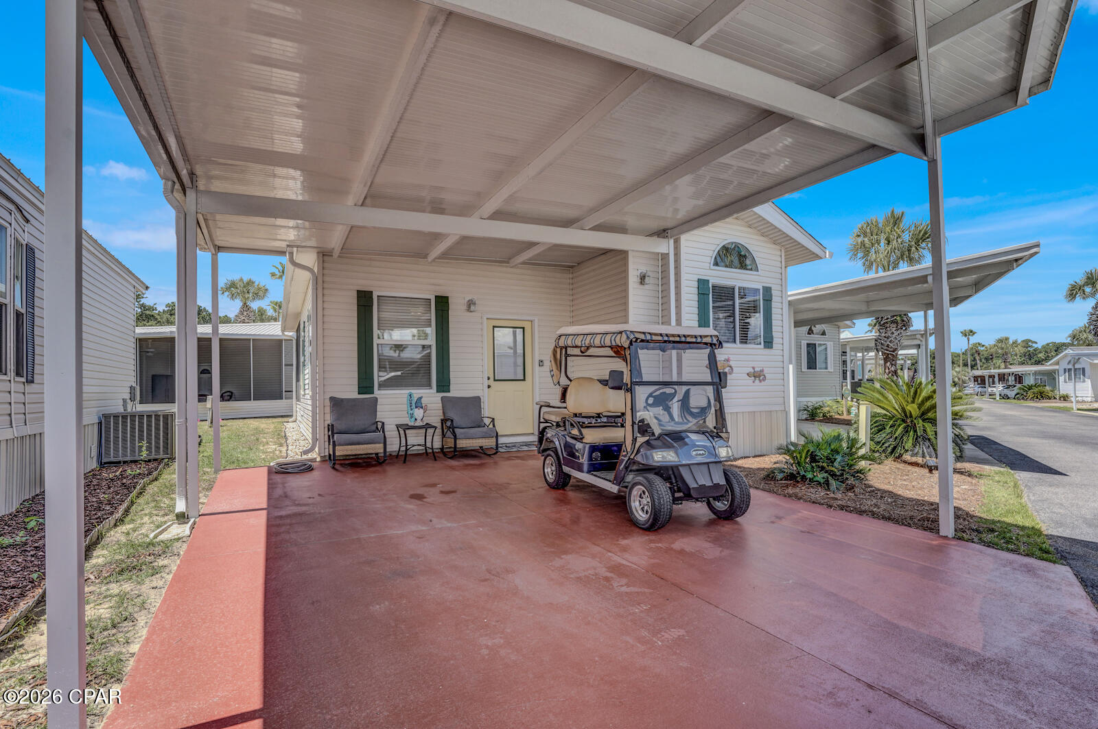 Welcome to Emerald Pointe Resort Unit 280! This fully furnished 2-bedroom, 2-bath home offers approximately 856 square feet with vaulted ceilings, a spacious living area, an elevated kitchen and dining space, and a large screened porch. The kitchen provides ample cabinetry, generous countertop space, breakfast-bar seating, and an open view into the living room.

Outside, the oversized covered parking area provides room for multiple vehicles or golf cart. The golf cart will be included with a full-price offer.

Emerald Pointe is a gated community offering a clubhouse, fitness center, community pools, fishing, recreational areas, and convenient access to Panama City Beach, marinas, shopping, dining, and the Navy base. This move-in-ready property is well suited for a primary residence, second home, or coastal getaway.