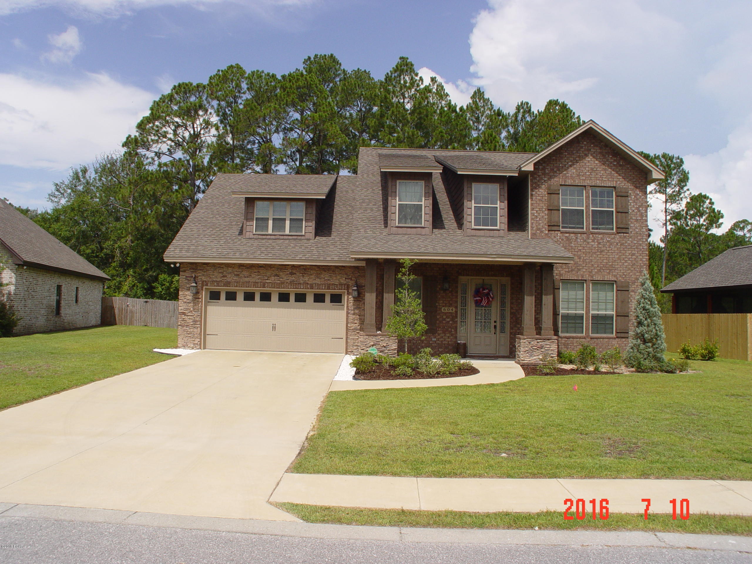 Beautiful immaculately maintained home available for 1 up to 3 year lease. Granite counter tops in the kitchen, bathroom vanities. Master bathroom has a tiled separate shower and a whirlpool tub and very spacious walk-in closet. This home has hardwood floors, ceramic tile, and carpet. Appliances included in the lease are a side-by-side refrigerator with bottom freezer and filter water with dispenser for ice and water in the door. Garbage disposal, electric glass cook top and separate wall oven with built in microwave and dishwasher. The washer and dryer are also included with the lease. Master bedroom suite with Master-bath is on first floor and the additional 4 bedrooms and 2 additional bathrooms are on the second floor. Quite neighborhood that is close to Tyndall AFB and the Navy Base.