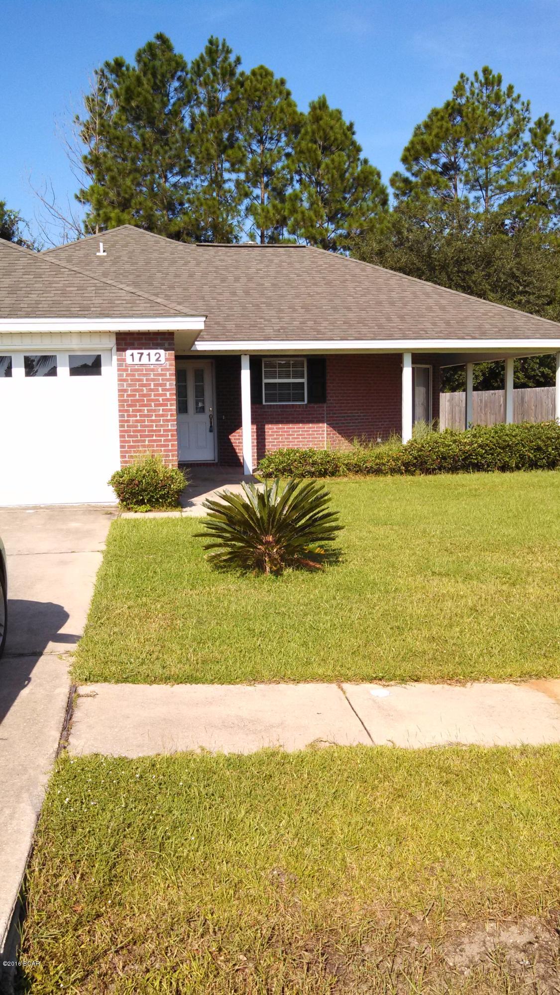 3 BEDROOM 2 BATH HOME W/2 CAR GARAGE, WOOD BURNING FIREPLACE, FRONT PORCH, OPEN PATIO W/SHOWER AND SCREENED IN PATIO.