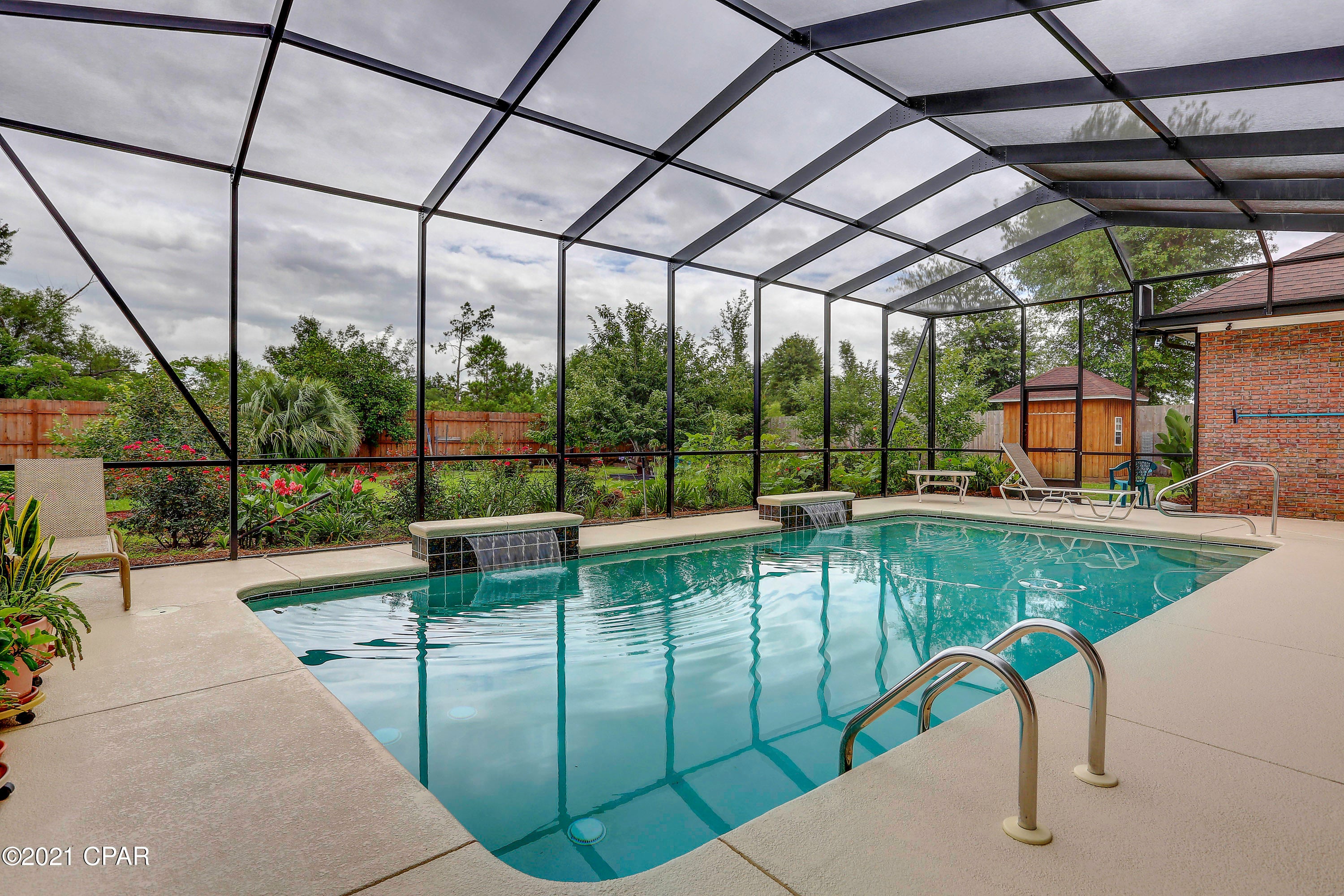 FABULOUS EXECUTIVE HOME IN COLLEGE POINT, on a 3/4 acre lot, waiting for you! The first thing you will notice is the beautifully landscaped yard, which is a hint of things to come. Be sure to check the list of amenities under ''documents'' in the MLS. Entering the foyer with 14' ceilings you come into the formal living area that has 12' ceilings and French doors leading to the covered back porch and screened-in saltwater pool. The pool has a swim jet, so you can swim miles without doing one flip! Large formal dining room has wood floors and 12' ceilings. The family room, also very spacious, has built-in bookcases, gas fireplace, wet bar...a great gathering area and access to screened pool area. The kit has beautiful custom cabinets, granite counters, a breakfast bar, granite counters, stainless appliances, double ovens, pull out shelves in the pantry and an island that is

perfect for food prep! MBR is HUGE, has new wood flooring and has plenty of room for a sitting area or office. The 12' ceilings make it feel even more grand! Two large walk-in closets on the way to the MBA, which is complete with 2 vanities and lots of cabinets and storage, whirlpool tub, walk-in shower and water closet. A split bedroom plan, on the other side of the home you will find oversized bedrooms; two share a jack and jill bathroom and the 4th is by itself, has a huge walk-in closet and has a full bath adjacent to it, making it perfect for guests. The laundry room has a utility sink and built-in cabinets and leads to the 3 car garage with 8 ft garage doors and a personnel door.  The backyard is huge and backs up to a small pond, that belongs to the adjoining golf course...great for catch and release. This home has many upgrades, besides the ones already mentioned, plus, great neighborhood, great school district, beautiful home!! Age, room sizes, sq ft, lot size are estimates. Please measure if concerned.