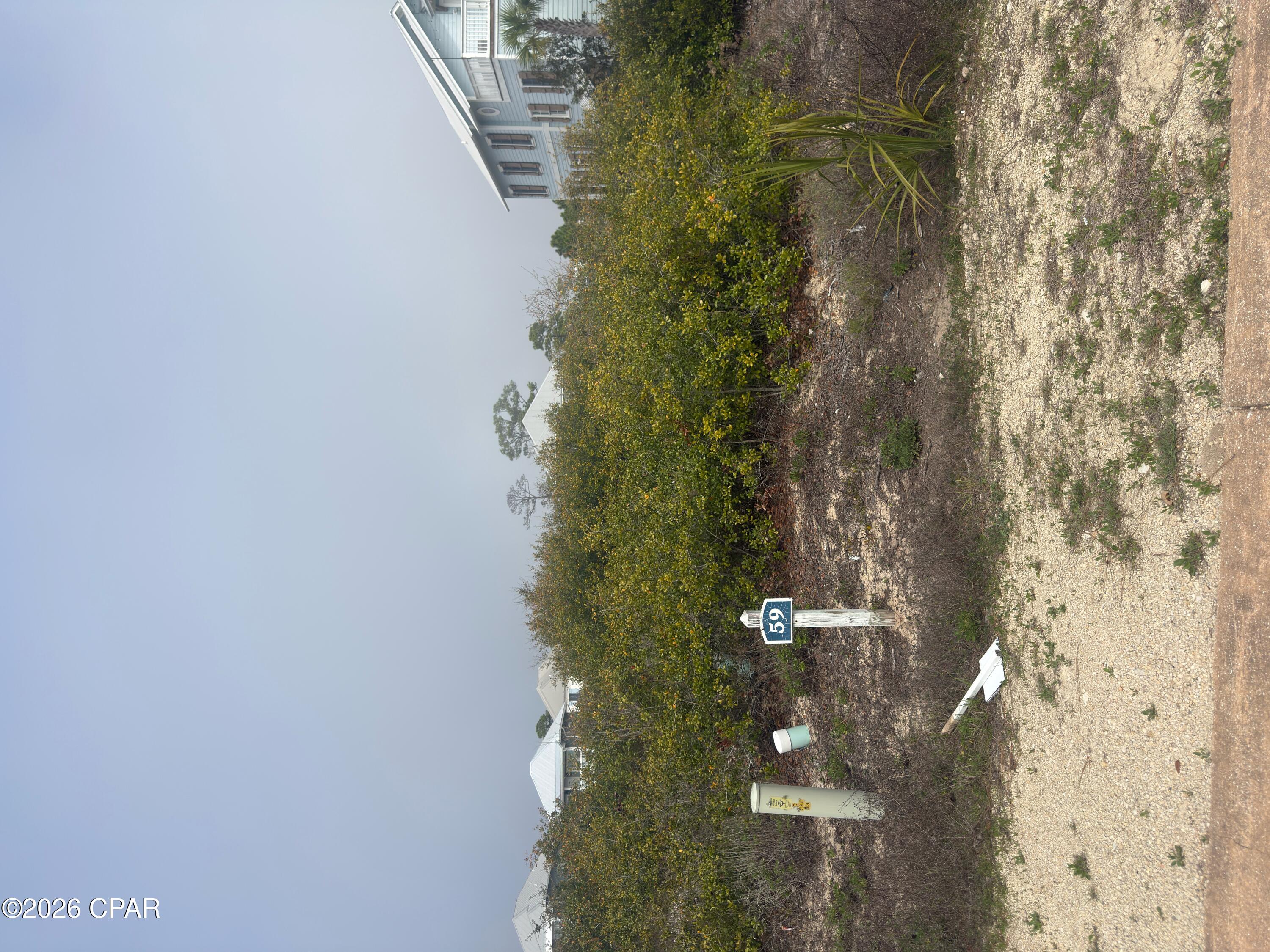 Excellent beachside lot with a substantial amount of X flood zone coverage. Possibly enough for a new home to avoid costly flood insurance or amend with a LOMA application. Located in the heart of the gated community of Jubilation, this platted and approved building site is only a few hundred feet from the community pool/ pavilion and beach access. Lot also has side and back alley access for different options. Jubilation is contiguous to hundreds of acres of undeveloped federal land for added seclusion. Priced to sell. Some dimensions taken from the Gulf County Property Appraiser's website, please verify if important.