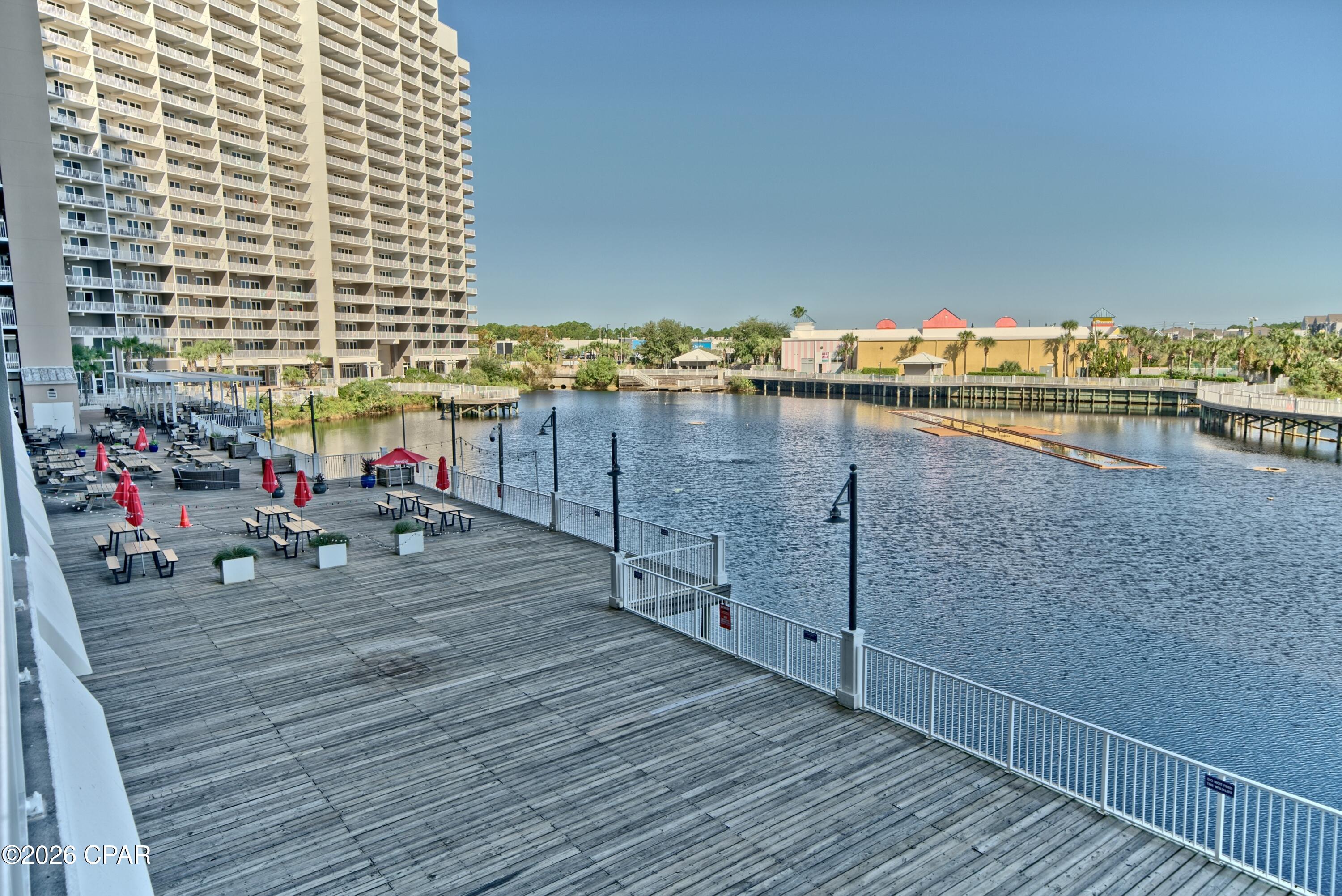 FIRST FLOOR UNIT 113 - SKIP THE ELEVATORS!
Great Investment Opportunity | Rental-Ready | Clean & Comfortable

This spacious 1-bedroom, 2-full-bath condo with a bunk room comfortably sleeps up to 6 guests, making it the perfect family getaway.

Located at Laketown Wharf Resort in Panama City Beach, this unit sits in the heart of all the action. Enjoy stunning lake and boardwalk views from your private balcony, with beach access just steps away.

Resort Amenities:
5 swimming pools
Splash Bar & Grill
Putting green
Pickleball court
Fitness center with brand-new equipment with Gulf views
Climate-controlled storage units on site

On-Site Dining & Retail:
Multiple restaurants on the ground floor, including a seafood buffet, tacos, pizza, BBQ and more
T-Shirt & Souvenir Shop
Tipsy Turtle Daiquiri Shop
Hair Salon
Ice Cream Shop
810 Bowling & Billiards

Walmart is conveniently located right across the street. You'll also find plenty of additional entertainment, dining, and attractions within easy walking distance.

Additional Highlights:
Clean, secure, and exceptionally well-maintained condo and grounds
24-hour security 
A front desk in a large lobby
Two oversized parking garages with ample space year-round
Ideal for short-term or long-term rentals
Owners can bring their pets