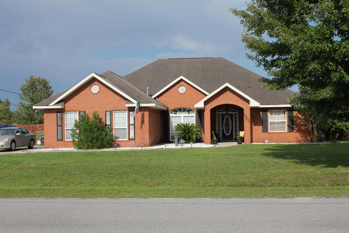 Convenient location, split floor plan, great neighborhood, and MOVE-IN READY! THIS BEAUTIFUL HOME HAS IT ALL! It's located in one of the best school zones in the county, and is just minutes from the Publix shopping center, 23rd St., and Tyndall AFB. Recent updates throughout include all new light fixtures, fans, faucets, hardware, custom backsplash, paint, and fresh landscaping. The home also features upgraded tile and wood flooring, walk-in closets in ALL bedrooms, Mediterranean-style archways, tray ceilings, w/ a Master Suite that boasts double vanities,  a soaking tub, and separate walk-in tiled shower.  The kitchen is a well-designed dream with 2 Lazy Susans, a pull-out pantry, and newer stainless steel appliances that will all convey. Step outside and enjoy an amazing covered porch