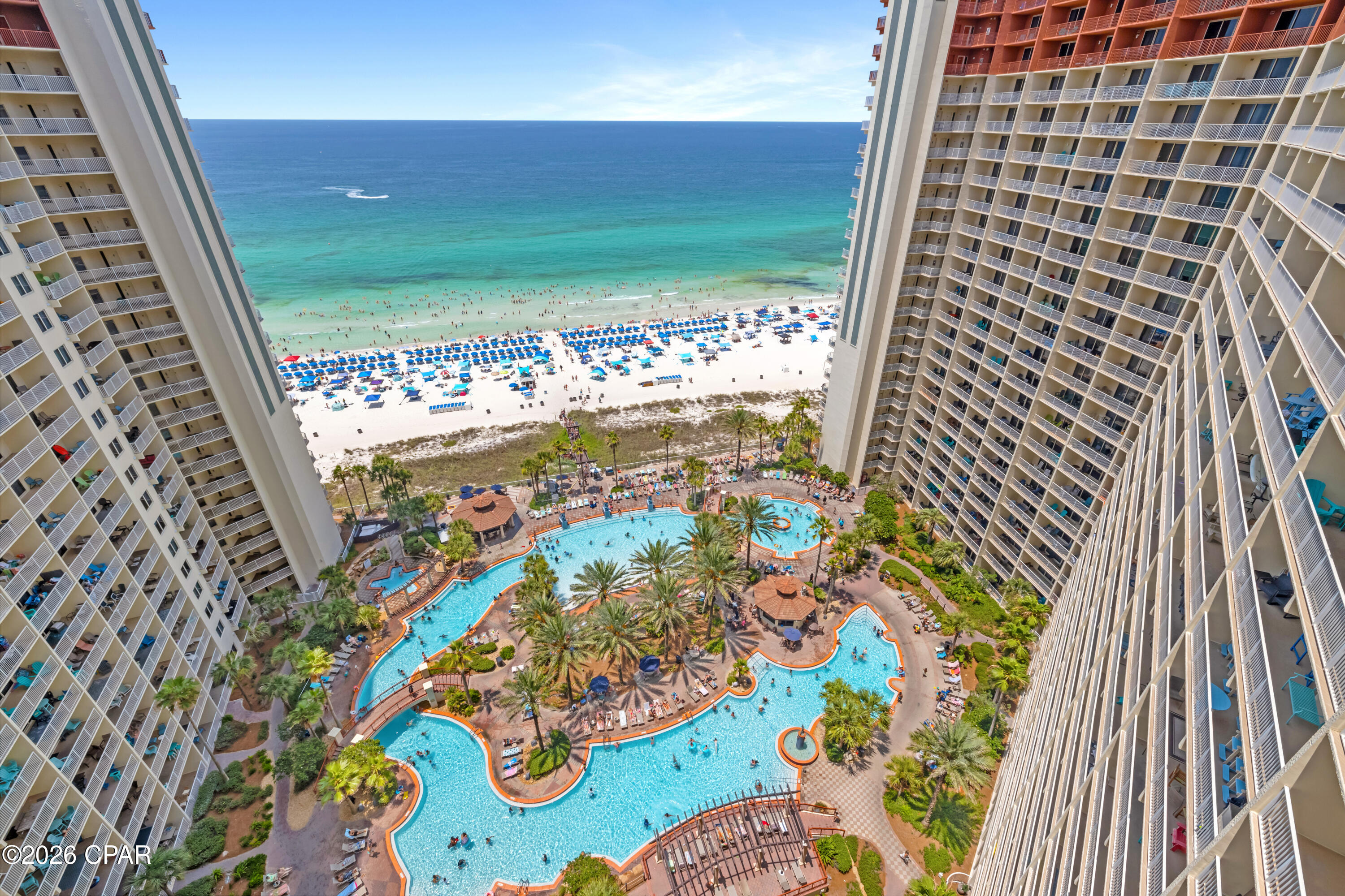 SUNSET VIEWS. GULF-SIDE PRIMARY BEDROOM. DEDICATED PARKING.
Shores of Panama 1917 is a C floor plan in Panama City Beach, offering a high-floor position, a large balcony, dedicated parking, and a Gulf-side primary bedroom with a large window framing Gulf views. This one-bedroom plus bunk layout includes two full bathrooms, modern furniture, coastal décor, updated light fixtures, and LVP tile flooring throughout the entire unit.
The kitchen features granite countertops, white appliances, a white subway tile backsplash, and a kitchen island wrapped in shiplap. The living area opens to the large balcony, creating an easy indoor-outdoor connection with sunset views and a strong resort-view setting. The hall bunk room includes access to its own private full bathroom, giving the floor plan added functionality beyond a standard one-bedroom layout.
The primary bedroom is positioned on the Gulf side and includes a large window with Gulf views. The primary bathroom features a tiled tub/shower combination. Additional interior details include a full-size front-load stackable washer and dryer, whole-unit dehumidifier, water heater from 2017, and original HVAC.
Shores of Panama Resort features one of the largest Gulf-front lagoon-style pools in Panama City Beach. The zero-entry tropical pool includes palm-lined islands, fountains, and a spacious hot tub along the resort's private beachfront access. Additional amenities include an indoor heated pool and hot tub, a 24-hour fitness center, and a seasonal poolside Tiki bar.
Located in the heart of Panama City Beach, Shores of Panama places dining, shopping, and entertainment nearby. Pineapple Willy's is adjacent to the resort, while Laketown Wharf directly across the street offers dining, retail, and entertainment options including Wharf Seafood Buffet, The Candymaker Ice Cream Shop, PCB Pizza, In Cahoots, The Press, The Bun Lab, 810 Billiards & Bowling, salon services, and more. Panama City Beach has also welcomed newer attractions and entertainment venues including Dolly Parton's Pirates Voyage Dinner & Show, Topgolf, McGuire's Irish Pub, and Tootsie's Orchid Lounge.

HOA dues are $3,491.71 per quarter. One special assessment payment remains in the amount of $1,212.69. (4th quarter of 2026).
Approximate Gross rental income was $24,000 in 2024, $28,000 in 2025, and $26,500 year-to-date through the end of June 2026. 
All information, rental income, HOA fees, assessments, measurements, and property details are deemed reliable but not guaranteed; buyer to verify if important.