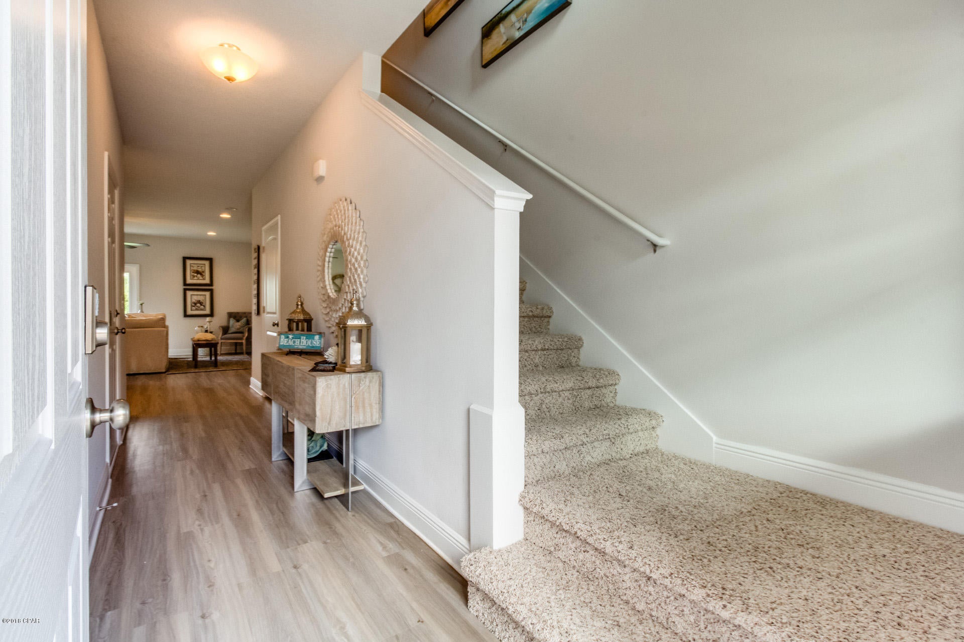 Back on Market! Move-in Ready!  Only 1.5 miles from the beach! Tucked back in a charming community, but still close to everything, this newly built interior townhome offers 9' ceilings downstairs and 8' ceilings upstairs with Ivory cabinets, Luna Pearl granite, and Washed Oak luxury vinyl plank flooring. An open and spacious floorplan with a huge master suite upstairs with a large walk-in closet and gorgeous master bath with high double sink vanity.