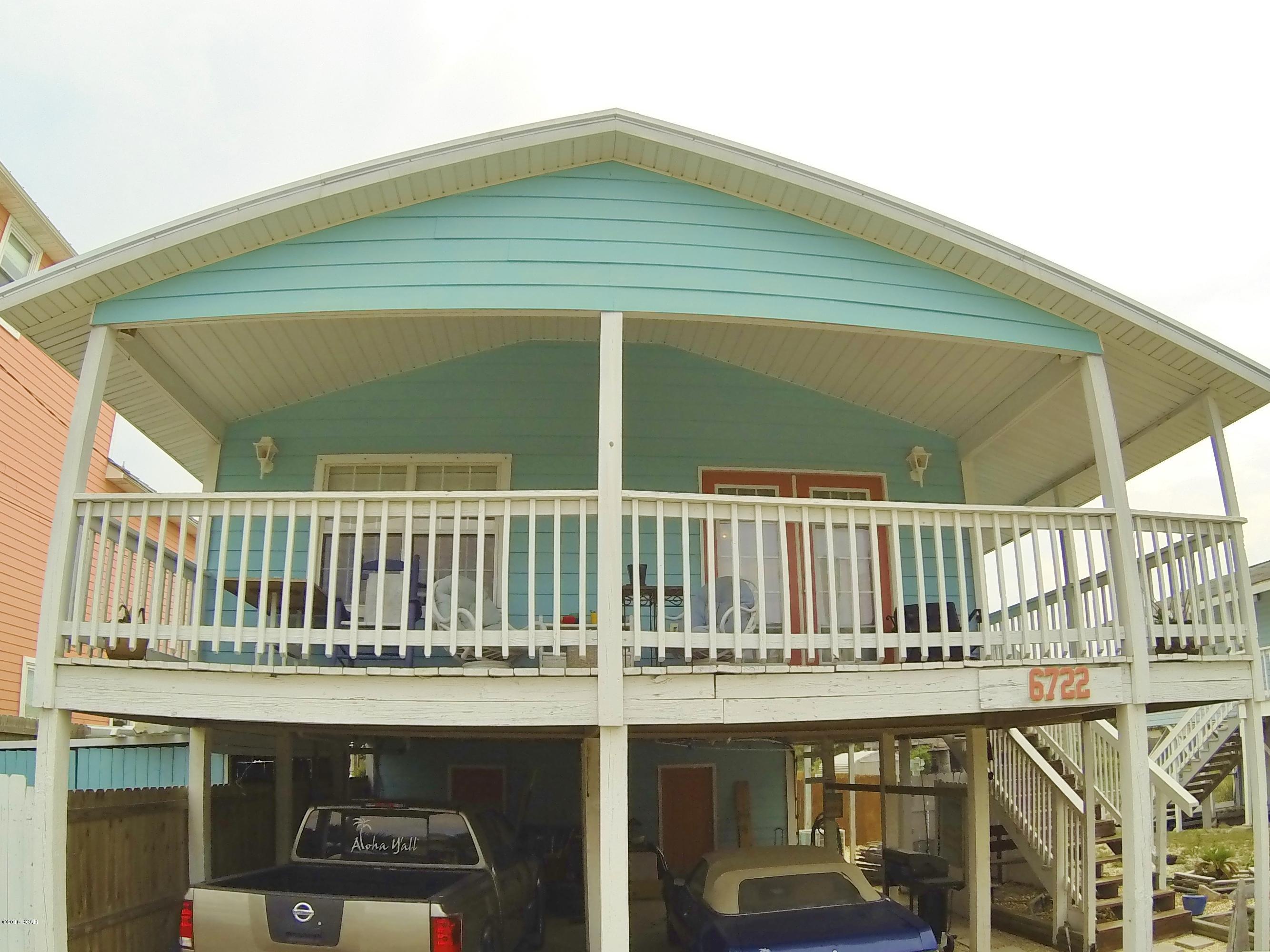 You will not find a cuter beach house this close to the beach! It is the perfect beach house. It has tons of outdoor living space. A covered front porch, open back deck, patio area for grilling, a fire pit, and a really nice hot tub. This house has tons of outdoor living, which is key here at the beach. The home is pretty maintenance and worry free. New metal roof, new siding, brand new A/C unit. It does need new flooring but it is priced so you can pick out whatever you like when you move in. There is a garden in the back yard and there's lemon and lime trees, and a fig tree, and hibiscus plants. When you walk into this beach house you feel right at home. Call me today for a chance to see it for yourself. It's the perfect primary, second home or a vacation rental. This one has it all. The square footage listed is per the County Tax website. It includes two rooms downstairs that are storage and laundry rooms, that are not heated and cooled. All measurements and information is to be verified if important to the buyer.