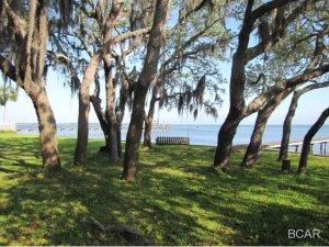 Estate size Bayfront lot with 184' on the bay that has fantastic views Great location convenient to both the 23rd. St. Corridor and the beaches yet quiet and private. New estate size homes on both sides of the this property. Has dock with boat lift and water deep enough to accomodate most 25' to 30' boats. Existing structure on property is in good condition but little or no value has been given. Value is in land. Property like this rarely available. Do Not delay!!!