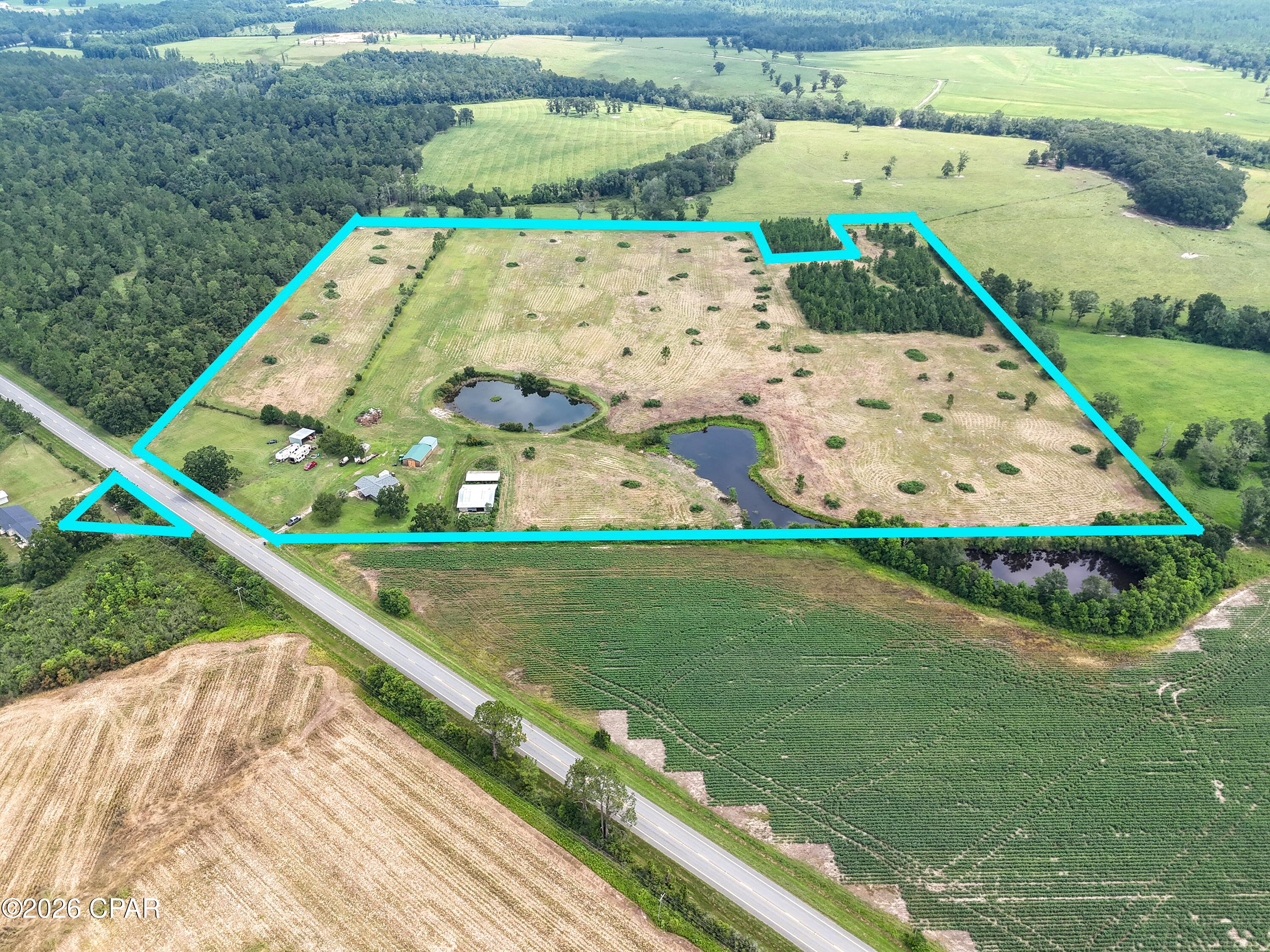 LOOKING FOR AN INVESTMENT PROPERTY TO MAKE INTO AN RV PARK OR A FARM THAT HAS EVERYTHING YOU COULD POSSIBLY NEED? 
This is it!   
Highly sought after property in DeFuniak Springs!   RV HOOK UPS, PONDS, and so much more!  

Experience the freedom of country living with this beautifully updated homestead in DeFuniak Springs, where privacy, open space, and endless possibilities come together. Set on 38.5 picturesque acres, this property is ideal for those dreaming of a working farm, equestrian estate, recreational retreat Investment property for a future RV Park or simply a quieter way of life. 

Inside, you'll find warm tongue-and-groove wood ceilings, an inviting open floor plan, and a wood-burning fireplace that generous counter space, a large center island with seating, and modern finishes throughout. Step outside to enjoy 3 beautiful ponds, fenced pasture, mature trees, and multiple outbuildings, including a barn with stalls and additional storage buildings. Whether you have horses, livestock, outdoor hobbies, or need space for equipment and projects, this property is ready to accommodate your lifestyle. 
Spend your evenings fishing by the ponds, exploring the property, or simply taking in the peaceful surroundings. While you will enjoy the privacy of rural living, you're still just a short drive from the conveniences of DeFuniak Springs and the beautiful beaches of the Emerald Coast. Offering the perfect balance of comfort, functionality, and natural beauty, this exceptional property is ready for its next owner to make it their own.