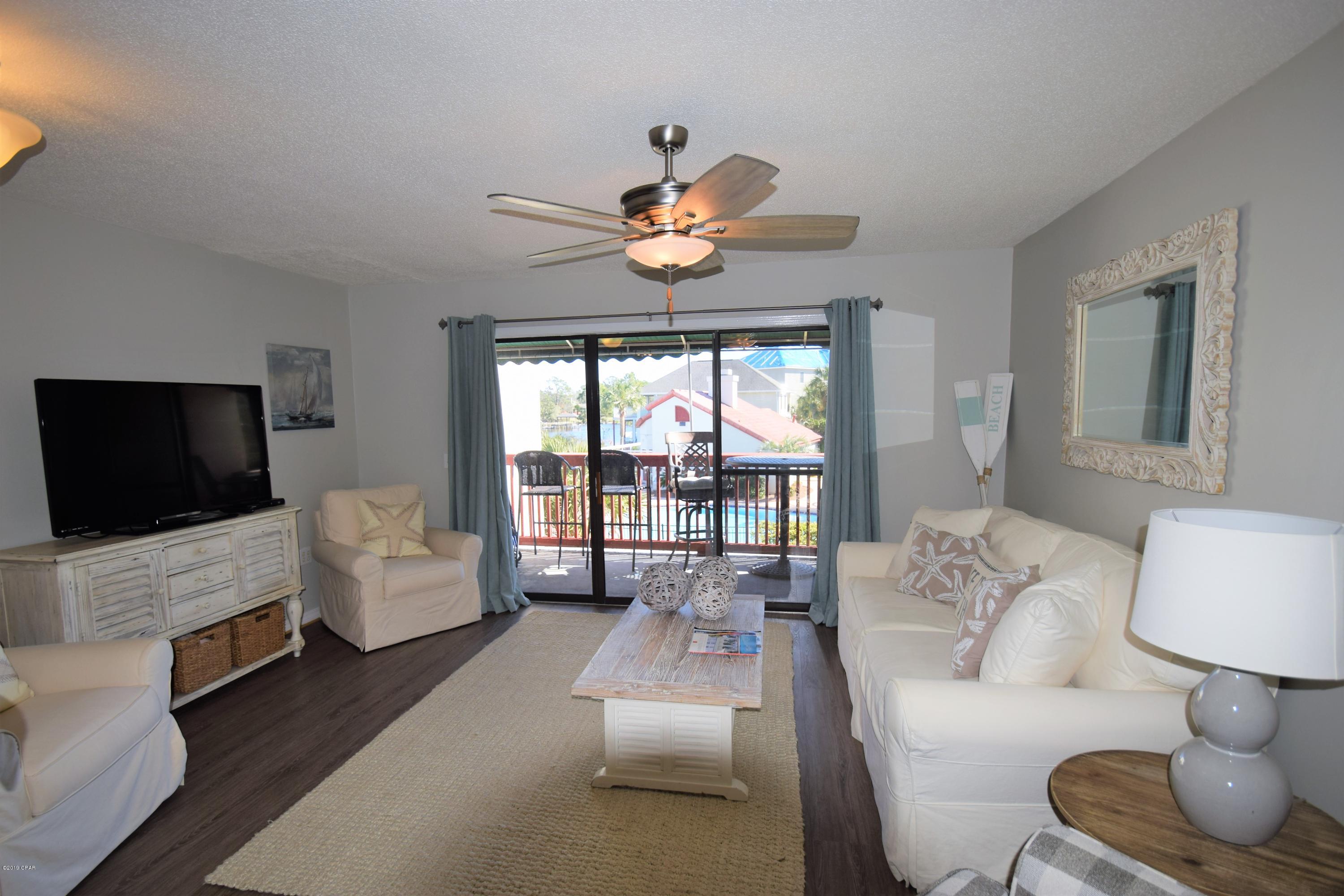 CURRENTLY UNDER CONTRACT, SELLER ACCEPTING BACKUP OFFERS. Beautifully remodeled two bedroom condo with a bonus room. The Bonus room is currently used as a third bedroom.Located in the Villas Of St Thomas Square, This is a Lagoon front complex with a dock, pool, and tennis court. It's just a short walk to the Gulf of Mexico and the sandy beach...Bring your boat and enjoy the  Lagoon views. Upgrades include. Granite Counter Tops, master bath shower, new flooring thru out., new bunk beds,  living room furniture, and light fixtures. This would make a great rental or a second home. The condo is being sold furnished. Call today for a showing.
