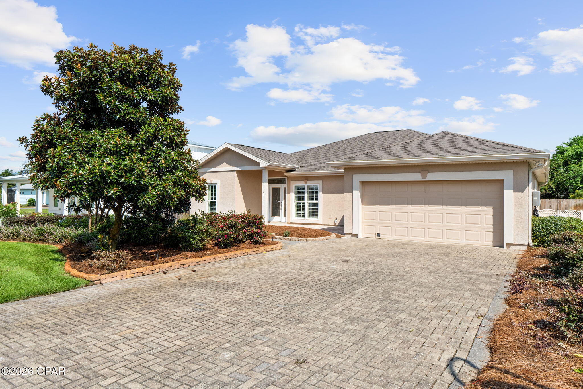 SUNSHINE STARTS HERE!! Coastal comfort awaits at this beautifully maintained Florida ranch home tucked into Magnolia Bluff. Situated on a high dry homesite in the ''X'' flood zone. This single-level living with spacious open floor plan creates a timeless coastal feel where you can entertain or simply unwind after a day at the beach. An easy flow between main living spaces makes everyday living comfortable while offering flexibility for hosting family & friends. The split-bedroom floor plan provides added privacy, making the home equally well suited for full-time living, a retirement retreat or a special coastal getaway. One of the home's most inviting features is the long covered & screened porch, the perfect spot to start your morning with coffee, enjoy an afternoon breeze or settle in for a quiet evening outdoors. With protection from the elements & plenty of room for comfortable seating, this outdoor living area feels like a natural extension of the home. Beyond the porch, the spacious quarter-acre yard offers room to garden, entertain, play or simply enjoy the laid-back Florida lifestyle. Magnolia Bluff is an established residential community in the St. Joe Beach area, where short-term rentals are not permitted, helping preserve the peaceful neighborhood atmosphere residents appreciate. Nearby homes in the community are also marketed for convenient access to St. Joe Beach & the area's golf-cart-friendly coastal lifestyle. Spend your days soaking up the sunshine, strolling the shoreline, fishing, kayaking or exploring the natural beauty of Florida's Forgotten Coast. When you're ready for a night out, shopping, dining & everyday conveniences in Port St. Joe are just a short drive away, while nearby Mexico Beach offers even more opportunities for waterfront dining, boating & beachside fun. Whether you're searching for a primary residence, peaceful retirement home or personal beach getaway, this charming Florida ranch delivers the ideal combination of quality construction, comfortable living, outdoor space & an exceptional coastal location without the constant turnover of vacation rentals. Come experience the quieter side of beach living & discover why St. Joe Beach continues to be such a special place to call home. Call for your private tour & LIVE THE BEACH LIFE!