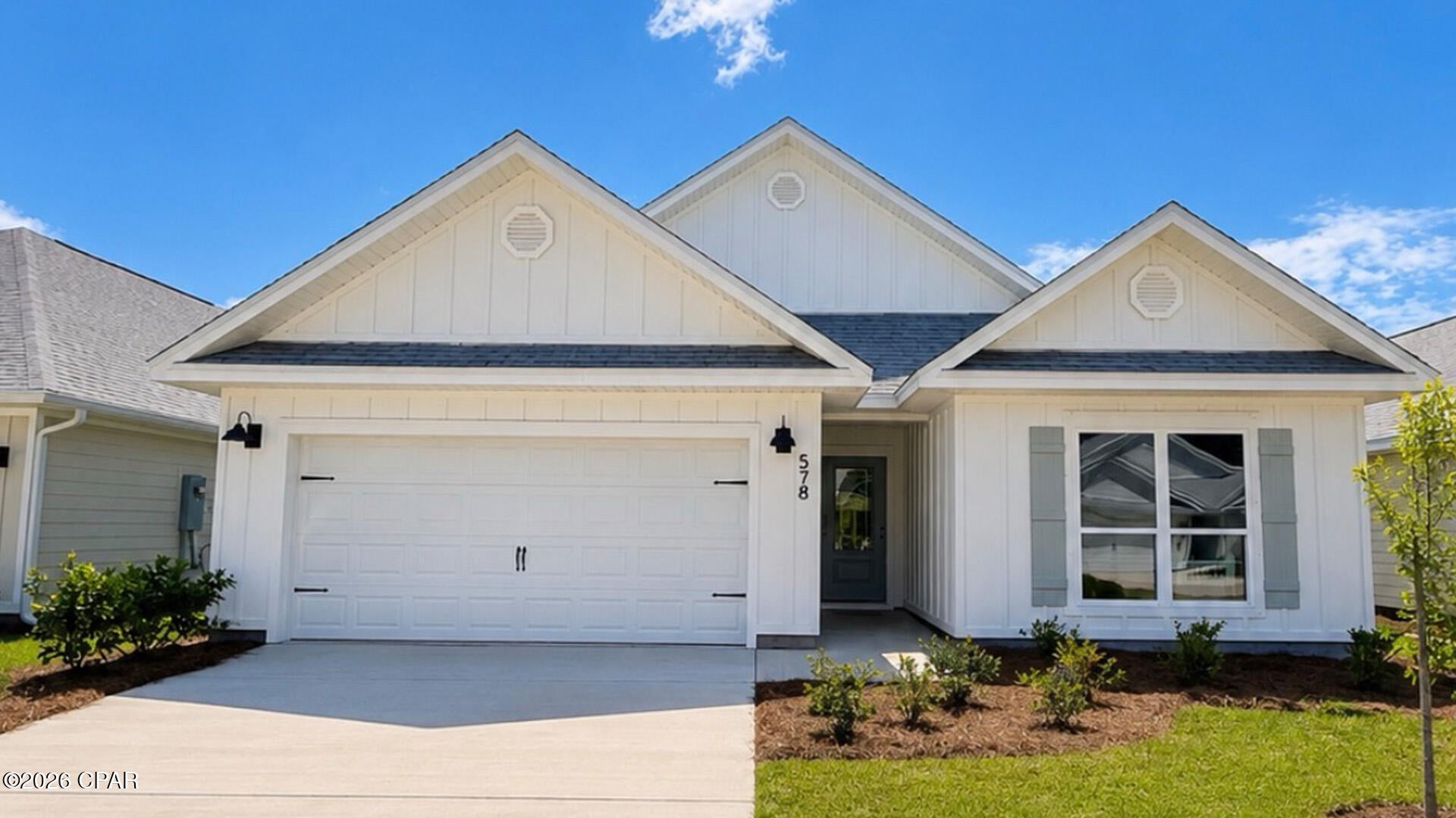 Welcome to 569 Hancock Way at Bayside at Ward Creek in Panama City Beach Florida. This home is under construction and features the Delray floorplan. As you walk into the home you will find two bedrooms off the entry hall with a full bath in between. The laundry room located across the hall is spacious and offers space for storage if needed. There is a fourth bedroom that could serve as an office space/ flex room/ bedroom next to the laundry room. The heart of this home is the spacious living area that is open to the kitchen. 

This floor plan flows seamlessly with beautiful EVP flooring throughout the main living areas and carpet in each bedroom. The kitchen is equipped with brand name stainless appliances including a smooth top stove, microwave, and dishwasher as well as a center island with lower cabinetry. The beautiful white cabinetry compliments the elegant quartz countertops and offers a bright feel to this spacious home. 

The primary bedroom is located at the back of the home offering a private retreat and it features an ensuite bathroom with EVP flooring, quartz countertops and beautiful white cabinetry. The bathroom is designed with two spacious closets, a large shower with glass enclosure and a dual sink vanity