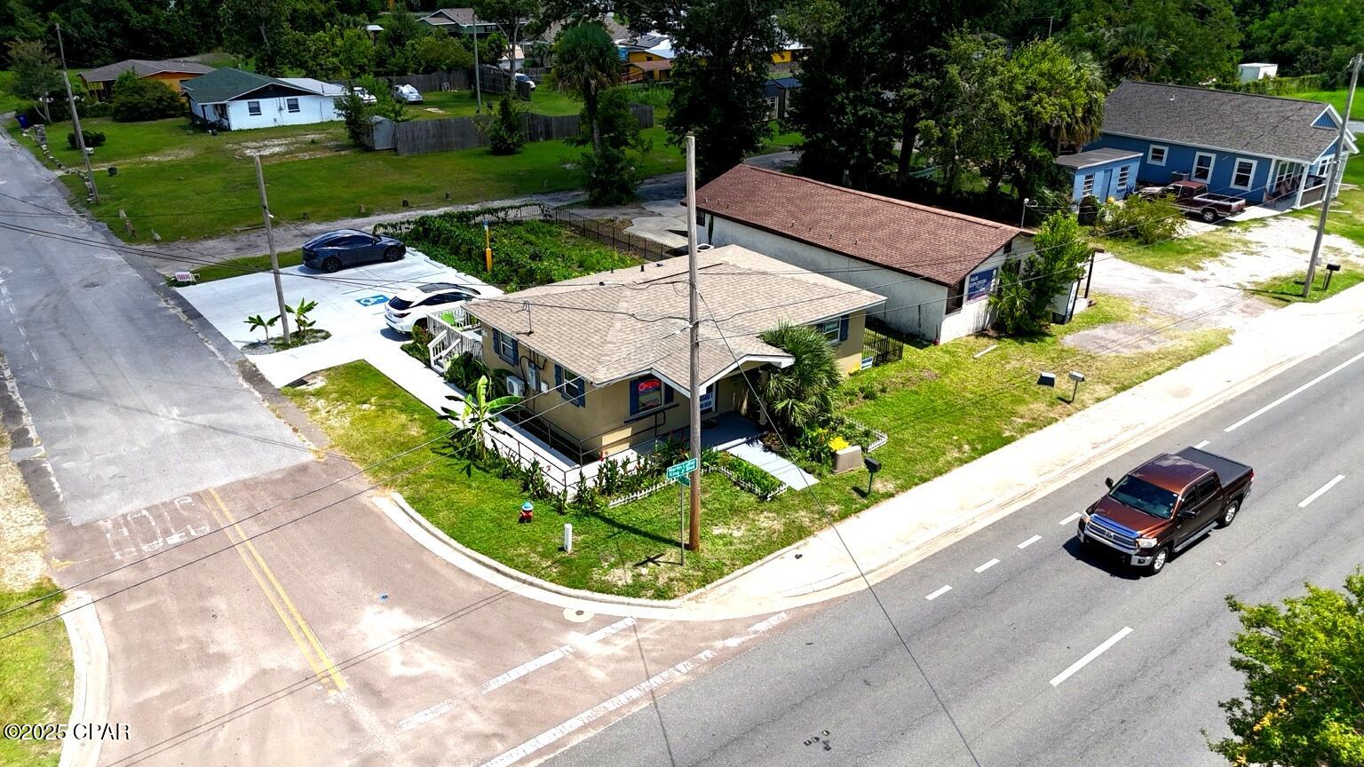 LOCATION, LOCATION, LOCATION! This centrally located corner property on a high-traffic road offers excellent visibility and versatility â'' ideal as a private residence or to continue being used as a business, with proper permits already in place. The property features laminate flooring (installed in 2021), a new roof (2020), and a new central HVAC system (2024). A commercial-grade parking lot was recently added, providing ample parking in the rear for clients, employees, or guests.