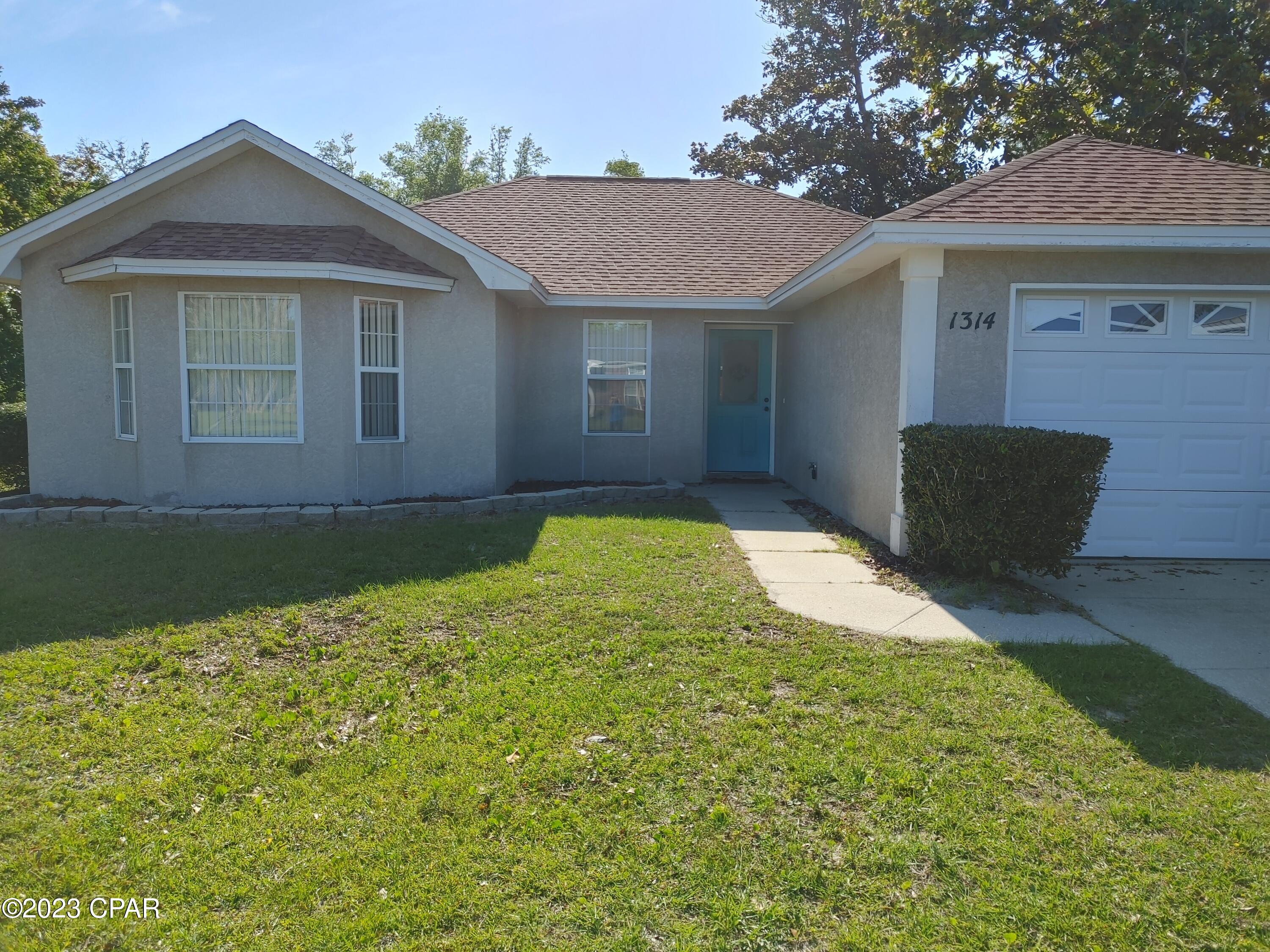 Nice home with LVP flooring in most areas, tile otherwise...no carpets to worry about. 3 bedrooms, 2 full bathrooms, split floorplan, screened back porch, playhouse (or chicken coop) for the kiddos, large laundry room and 1 car garage. Easy access to shopping and schools.  Room sizes are approximate. Lease and approved application required. No pets.