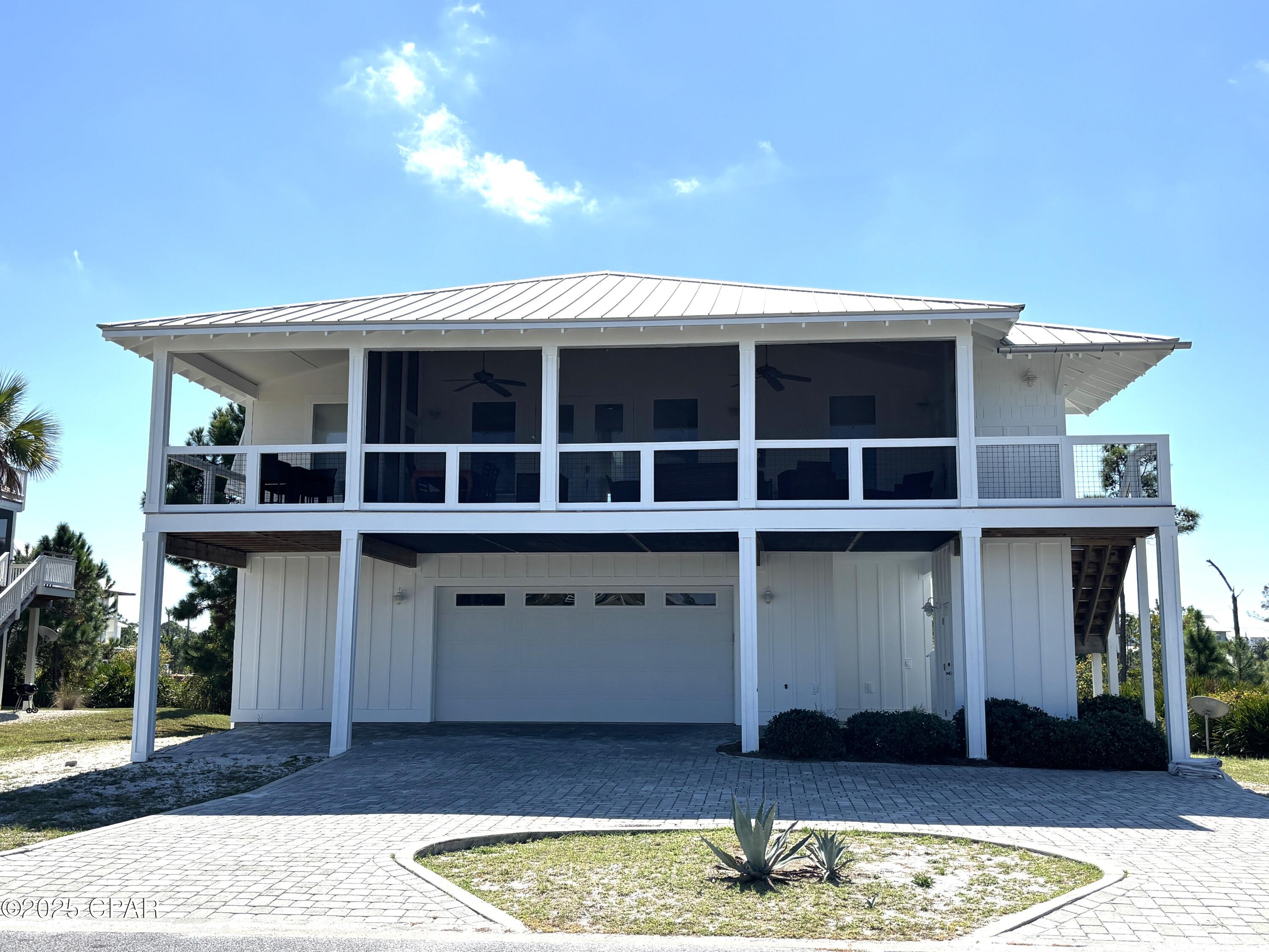 This North Cape San Blas vacation home gem checks all the boxes! Gulf side, Dedicated Beach Access via Secluded Dunes, with beautiful views of St Joseph Bay. Located in the Gated community of Park Point at Secluded Dunes on North Cape San Blas, this subdivision is surrounded on three sides by St Joseph's State Park and additional conservation area. Less than 5 minutes to the park entrance with more beach and bay access options as well as a fully functional boat launch. Park Point also has a community pool as well as a dedicated beach access that meanders through beautiful coastal oaks and terminates at a very wide beach on the North Cape. Home has an open floor plan with vaulted ceiling and sky lights for a warm and welcoming feel. The spacious living and dining areas as well as a computer desk office nook flows well and is very functional. Kitchen with breakfast bar that has beautiful granite countertops and cabinetry. 4 bedrooms with 3 en suite bathrooms gives one privacy options throughout, while the 4th bathroom is easily accessed by guests. A large, well furnished, and full length, screened front porch is completely screened and has beautiful views of St Joseph Bay and the undeveloped state park. The lower level is accented by a brick paver driveway and natural landscaping. The enclosed garage is set up more like a huge bonus fun room that is appointed with; finished floor, sitting area with TV, ping pong table, cabinetry, additional functional space. Adjacent is the large bottom back screened porch complete with; large swim spa, grill, dining area ,and outside shower. Take a moment to view our 360 tour and feel free to ask for your virtual or private showing. Currently a vacation rental so this listing is appointment only. New buyer fee is a percentage of sales price, ask agent for details. Some dimensions were obtained via the Gulf County Property Appraiser's website. Please verify if important.