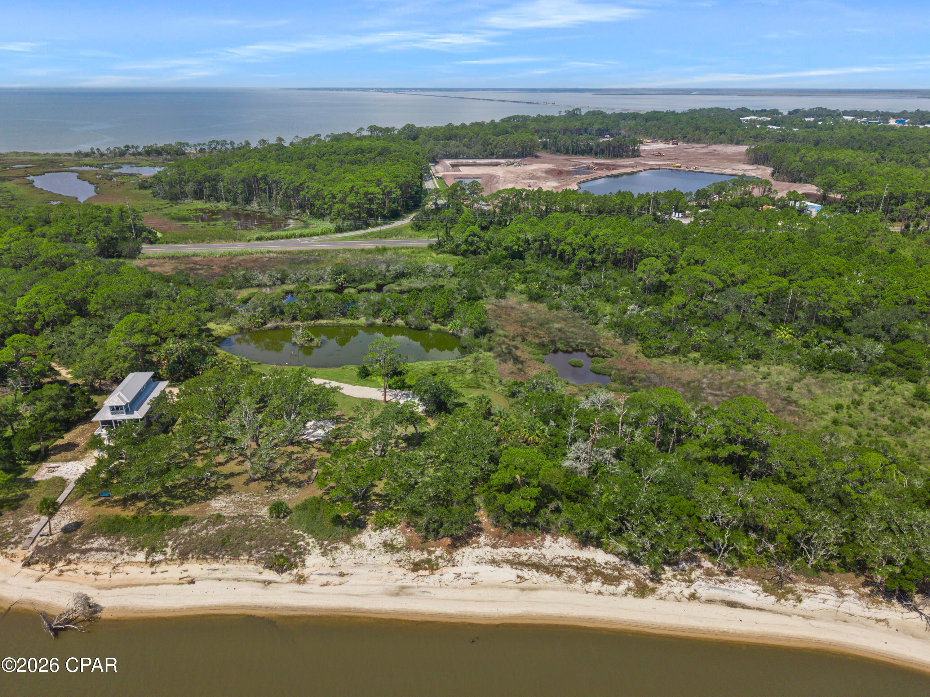 Some properties give you a place to build. This one provides you a setting worth building around.
Welcome to Cat Point, where approximately 1.32 acres of vacant land offer the rare opportunity to create your own coastal retreat for $425,000. 

Tucked among mature live oaks, pines, palms, and native coastal vegetation, this property offers unmatched privacy surrounded by the natural beauty of Florida's Forgotten Coast, far removed from dense crowds and high-rise development.
Here, life moves at the pace of the Bay. Spend mornings fishing or kayaking, afternoons on the pristine beaches of St. George Island, and evenings watching breathtaking sunsets as coastal breezes drift through the trees.
The neighboring Eastpoint Fishing Pier, the Apalachicola National Estuarine Research Reserve, and Cat Point Trail allow you to explore one of Florida's most remarkable coastal ecosystems right from your backyard. Historic downtown Apalachicola--with its charming seafood restaurants, boutique shops, galleries, and rich waterfront history--is just minutes away.
For buyers seeking an even larger footprint, the adjacent Cat Point Hideaway home on approximately 1.33 acres is also available separately, offering a rare chance to combine both parcels for a total of approximately 2.65 acres.
Opportunities to secure over an acre of untouched Forgotten Coast real estate at this price point are quickly disappearing. Don't just buy land--claim your piece of paradise today.

Note: Two additional adjacent parcels will also be available soon for a combined total of ~4.25 acres.