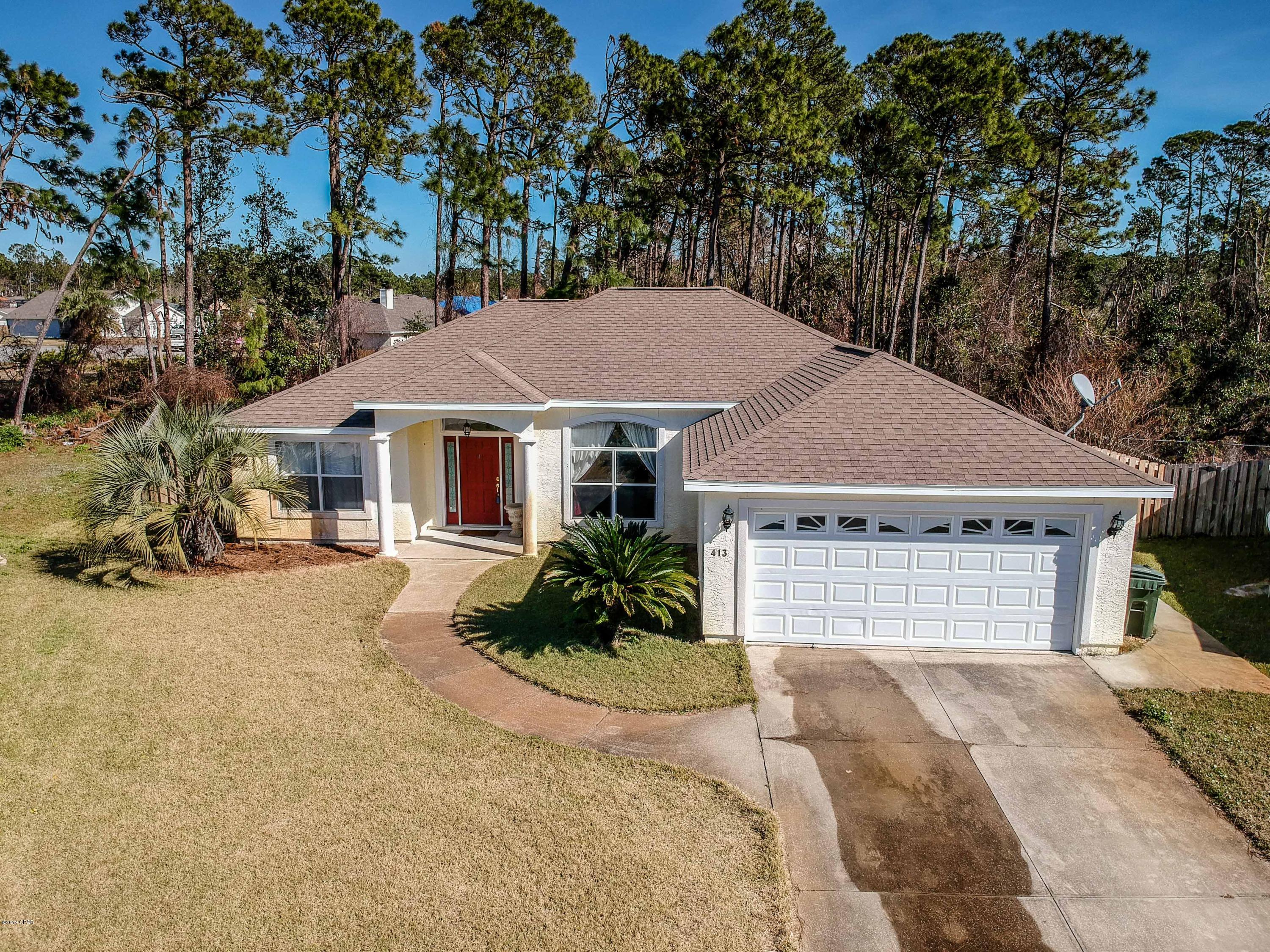 This lovely home was built in 2003 and is located in Hidden Pines Community.  Just minutes to the NCSC and the World's Most Beautiful Beaches!  The home has beautiful wood floors and an inground pool.  It is located in a quiet cul-de-sac with a preserve area behind the home great for relaxing and enjoying a quiet evening by the pool or grilling under the covered, back porch.  The home has a large, open living room with a fireplace and dining area, great for entertaining, a fully equipped kitchen with a breakfast area.  New stove will be delivered this week and water heater was just installed.   The home also offers a split floor plan with the master on one side of the home and the additional two bedrooms on the other.