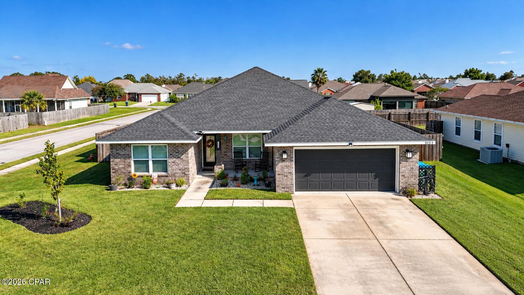 Rich in upgrades and ready for its next owner, this 4-bedroom, 3-bath brick home sits in Panama City's highly desirable Cherokee Heights neighborhood. Classic curb appeal meets modern living throughout.

The open-concept layout is anchored by luxury vinyl plank flooring, tray ceilings, and natural light that fills the main living spaces. The living room connects directly to the kitchen, where granite countertops, quality appliances, a walk-in pantry, and abundant cabinetry make cooking and hosting equally easy.

Set apart for privacy, the primary suite features its own tray ceiling, a generous walk-in closet, and a spa-inspired bath with double granite vanities, a soaking tub, and a separate walk-in shower. The additional bedrooms are well sized, offering flexibility for guests, a home office, or hobbies.

Storage is a standout here, with a dedicated storage closet, a floored attic accessed by pull-down stairs, and an attached two-car garage with space for vehicles, tools, and recreational gear.

Situated on a corner lot, this house is just minutes from shopping, restaurants, schools, medical care, and the Emerald Coast's white-sand beaches, this well-maintained home delivers quality, comfort, and convenience in one of Panama City's most sought-after communities. Schedule your private showing today.