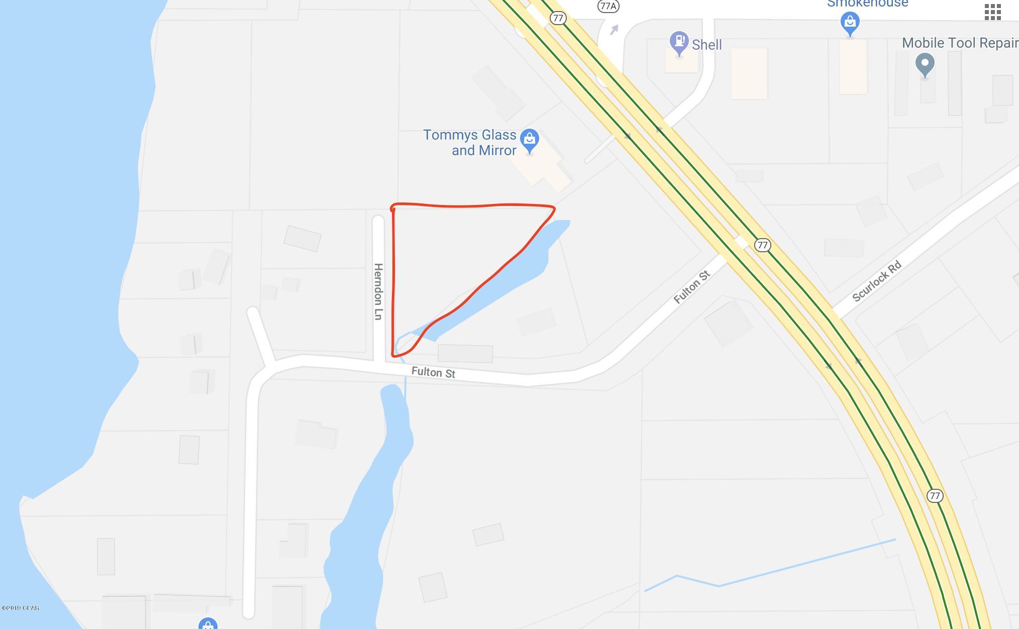 This 1/2 acre parcel is perfect for a new house or mobile home. Country living in a quiet setting and close to Panama City and beaches. Water view of North Bay. Paved county roads on two sides.