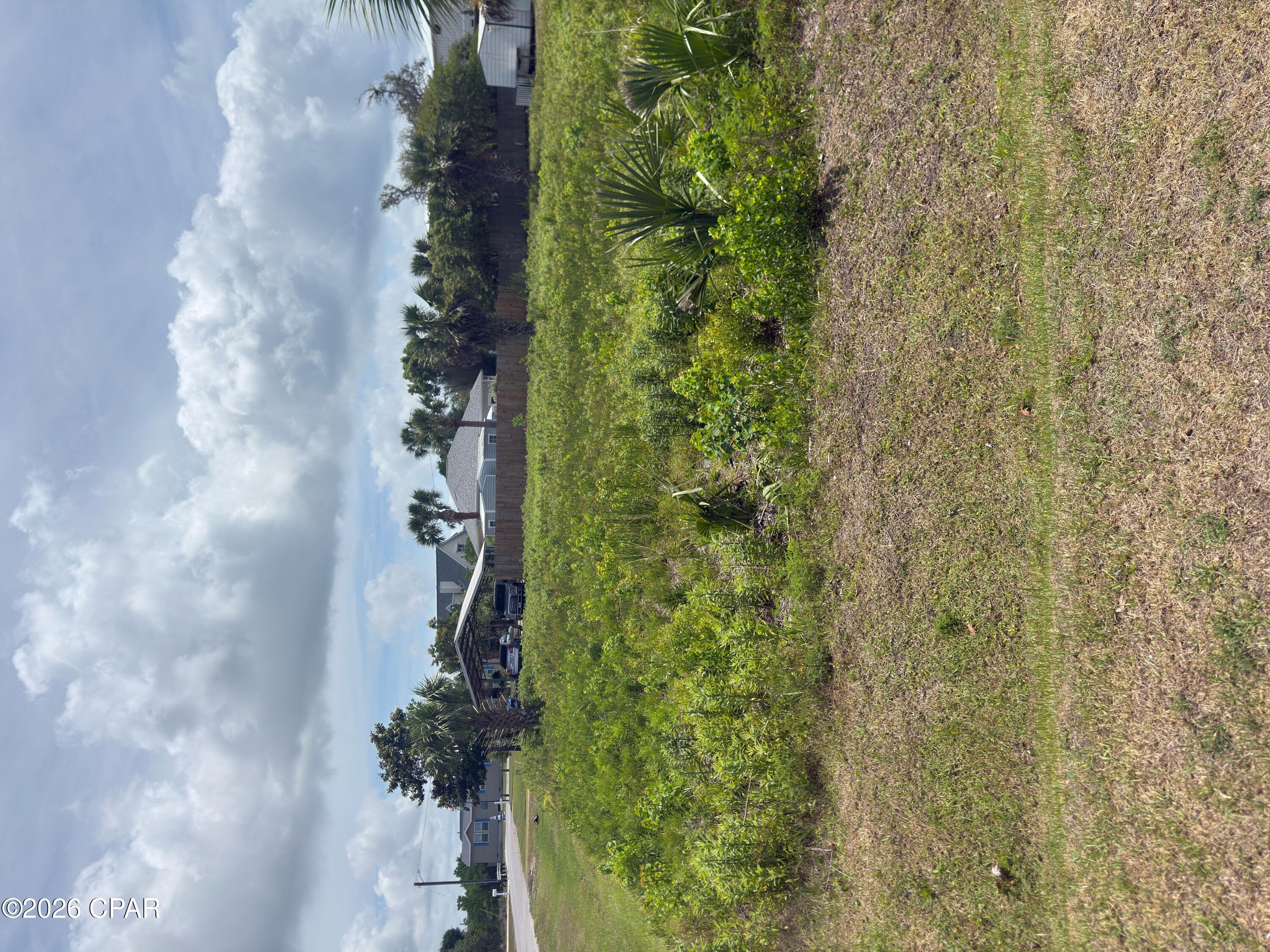 Corner lot with easy access to the dedicated and public beaches of Mexico Beach. Bring your building plans and vision as there is plenty of creative options on this homesite. Triple access options via Florida Ave., 1st St. or 20' alley. This X FLOOD ZONE lot is only about 600' from the beach, where one can enjoy a short evening walk or golf cart ride and witness some of the most glorious westerly facing sunsets anywhere. Easy back access to your neighbors, parks, commercial spots, and other locations via the Florida Ave Boulevard. Competitively priced in line with comparable sales in the same block. New survey on file. Parcel was recently split and is only 1/2 of the Bay County Property Appraiser's parcel ID #04806-000-000. Some information obtained via the Bay County Property Appraiser's website, please verify if important.