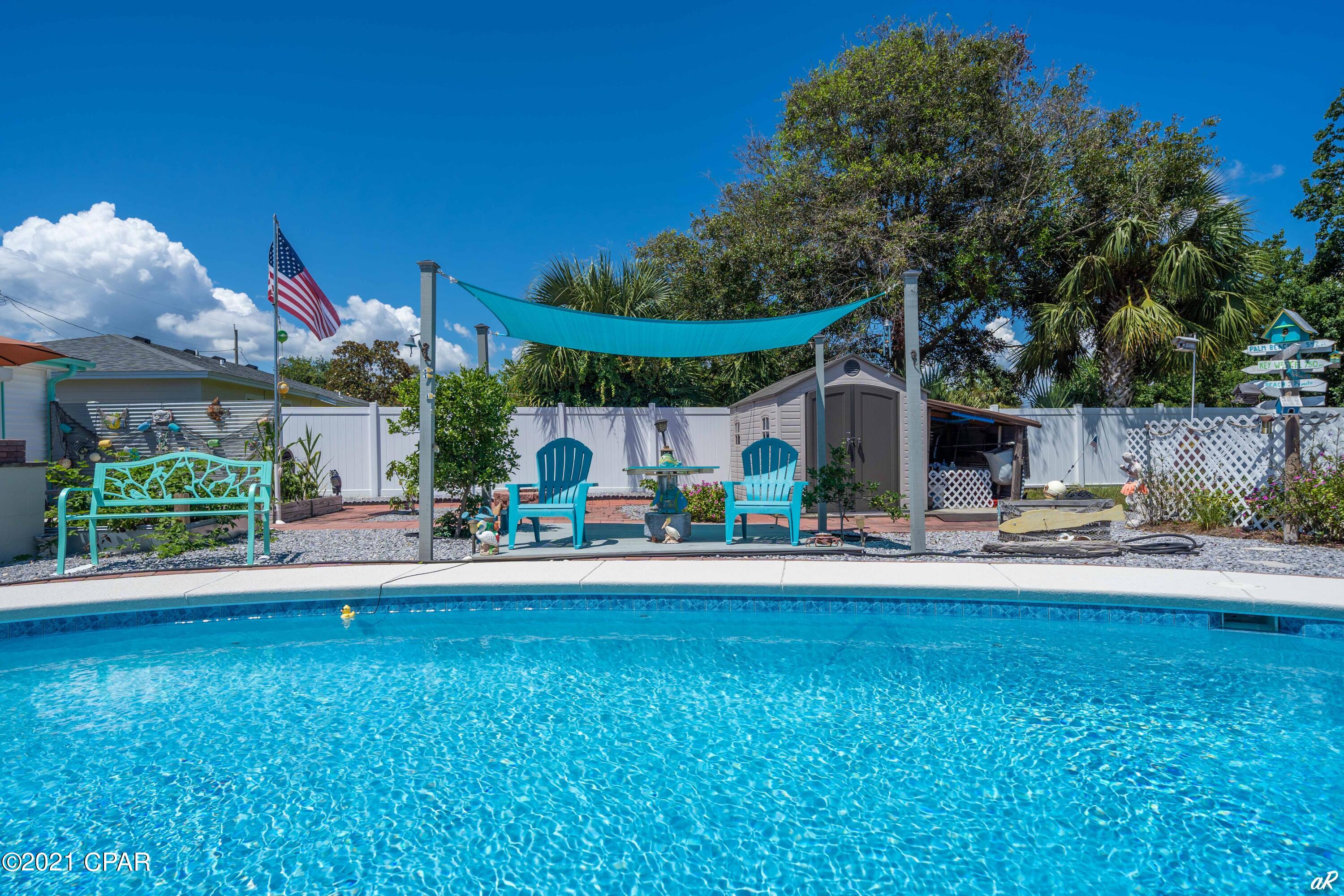 UNDER CONTRACT WITH CONTINGENCY, SELLER ACCEPTING BACK UP OFFERS.

Absolute show-stopper!  This meticulously maintained, newly remodeled home is located on one of the largest residential lots in Panama City Beach with a large 15x30 inground, kidney-shaped, saltwater pool and hot tub.  This home can be purchased fully furnished.  The home sits on nearly quarter of an acre and is a very short walk to the Gulf of Mexico.  Every single detail of this home was built with quality construction from the baseboards to the beveled interior doors.  The home features stainless steel appliances, sea-glass backsplash in the kitchen and bathrooms, granite countertops, and a Samsung washer and dryer. The flooring in this home is all LVP for ease of maintenance and cleaning.  The bathrooms in the home were updated with all new cabinets, and custom backsplash.  The rooms in this home are bountiful and plenty and all closets have ample room for storage.
The owner carefully picked the highest quality roll down hurricane shutters on each window, and the garage door has reinforcement bars for extra protection from the wind and elements.
A new Jeldwen sliding glass door was installed with internal blinds for privacy.
The owner spent a small fortune on the exterior of this home installing hardscapes, granite, marble, and brick pavers.  In addition, there are several planters in the back yard with vegetables and fruit trees.  There is an open porch and cabana seating area beside the pool.
The roof is only seven (7) years old.
You won't find another home on Panama City Beach that has been thoughtfully designed, meticulously maintained, and appreciated as much as 509 Gardenia Street.
Don't hesitate to schedule an appointment to see this amazing home with your Realtor, and prepare to be amazed.