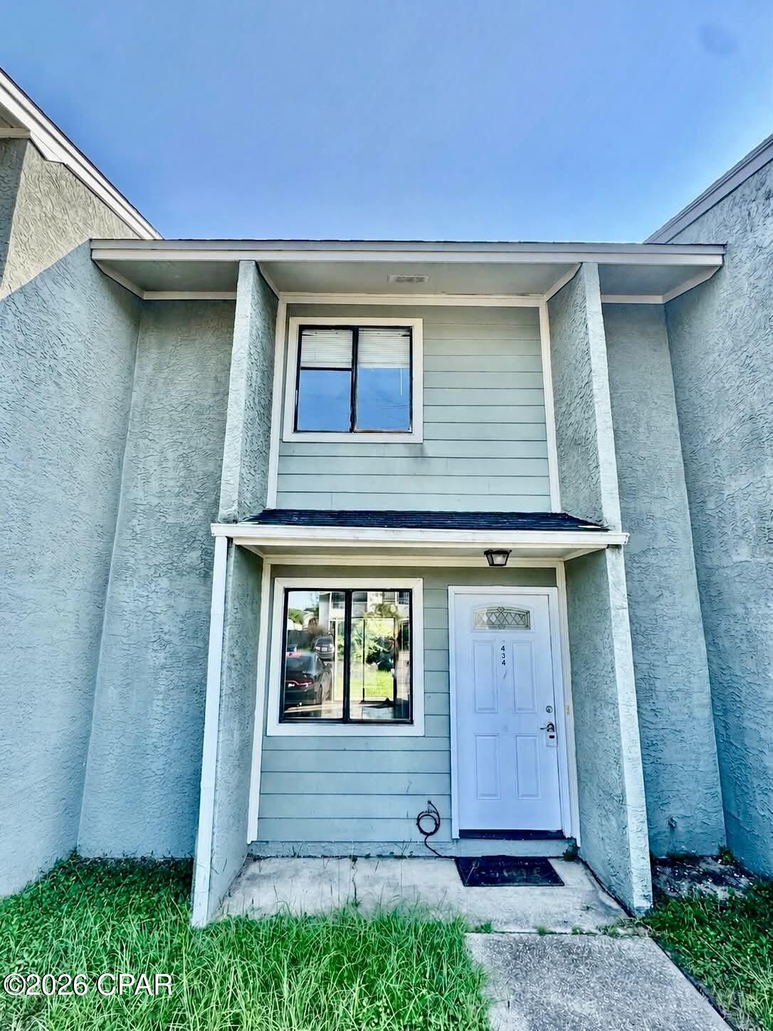 'CURRENTLY UNDER CONTRACT, SELLER WILL CONSIDER BACKUP OFFERS*EXISTING WINDOWS FEATURE NEWLY REPLACED GLASS** Centrally located townhome in Venetian Villas with NO HOA. This property offers a great opportunity as a primary residence or rental investment. The home features a fenced-in backyard with a covered porch, perfect for outdoor relaxation or entertaining. Inside, you'll find a convenient half bath located downstairs for guests and everyday functionality, while all bedrooms are privately situated upstairs.

Ideally located just 15 minutes from the white sandy beaches and close to restaurants, shopping, and everyday conveniences in Lynn Haven and Panama City. Low-maintenance living in a location that keeps you close to it all.
